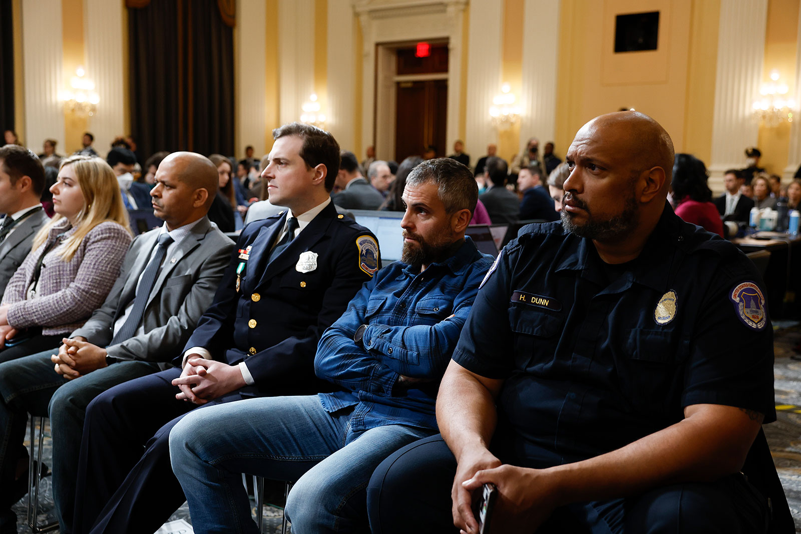 From second left to right, former US Capitol Police Sgt. Aquilino Gonell, Metropolitan Police Officer Daniel Hodges, former Metropolitan Police Officer Michael Fanone and USCP Officer Harry Dunn listen to the final public session of the House select committee. 
