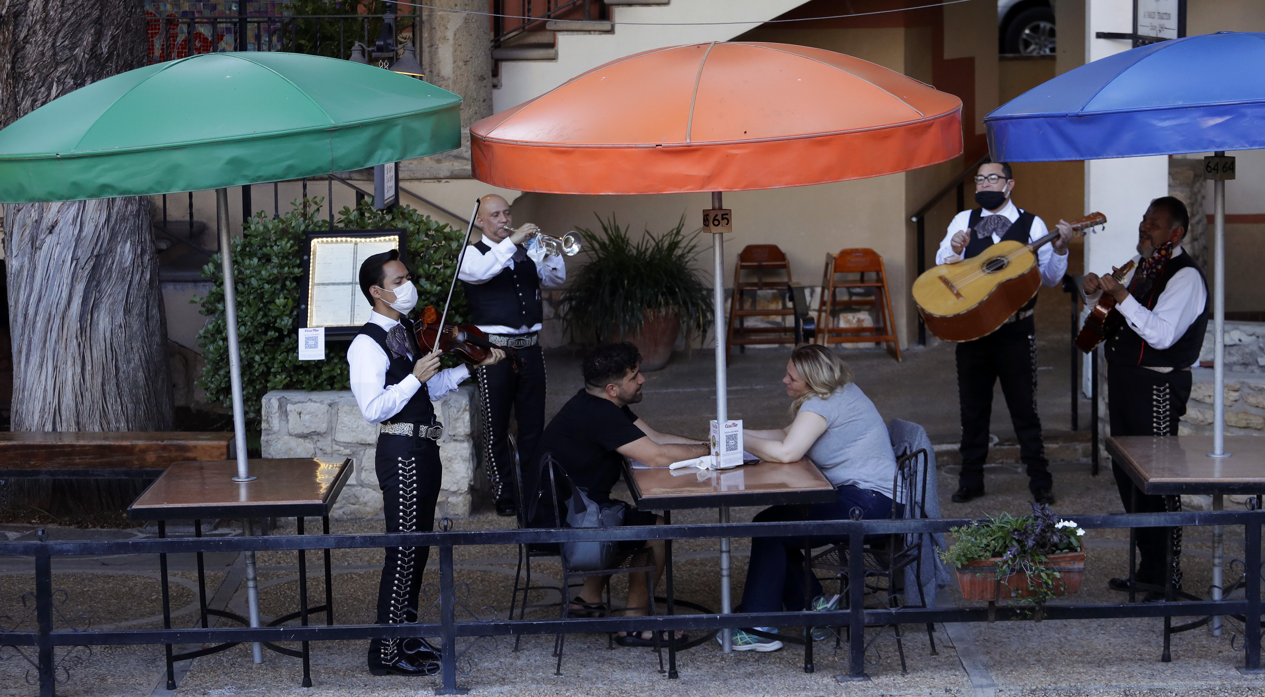 Mariachi Mexicanisimo plays for diners at Casa Rio after it reopened in San Antonio on May 18.