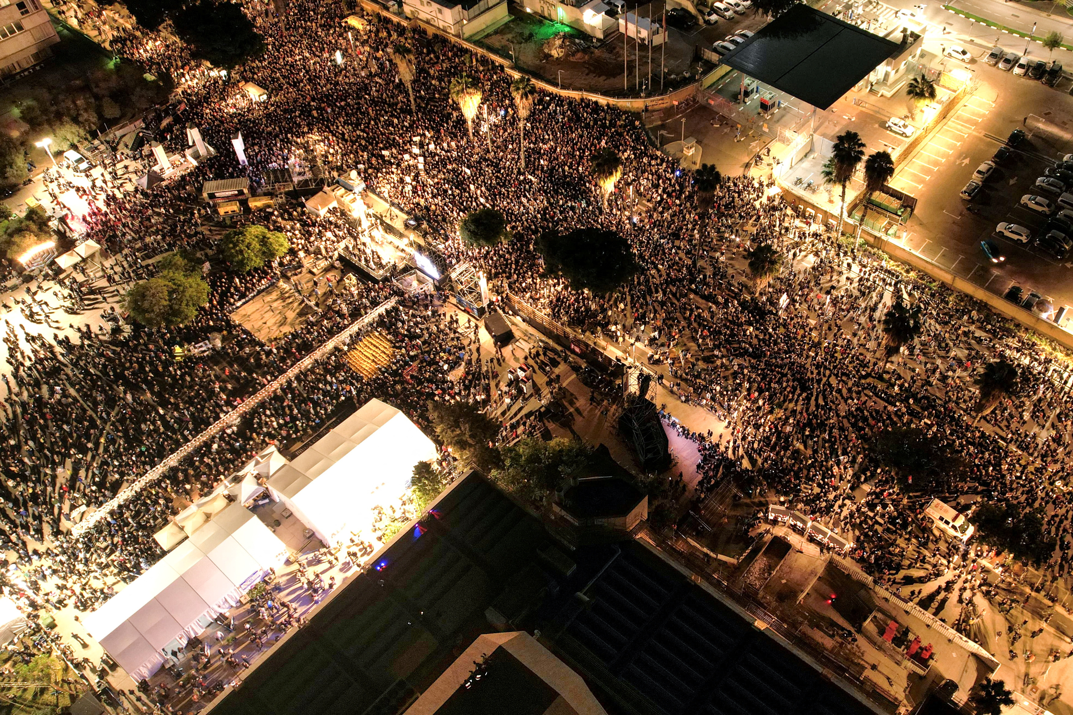People gather in Tel Aviv, Israel, to demand the release of hostages held in Gaza on Saturday, December 16.