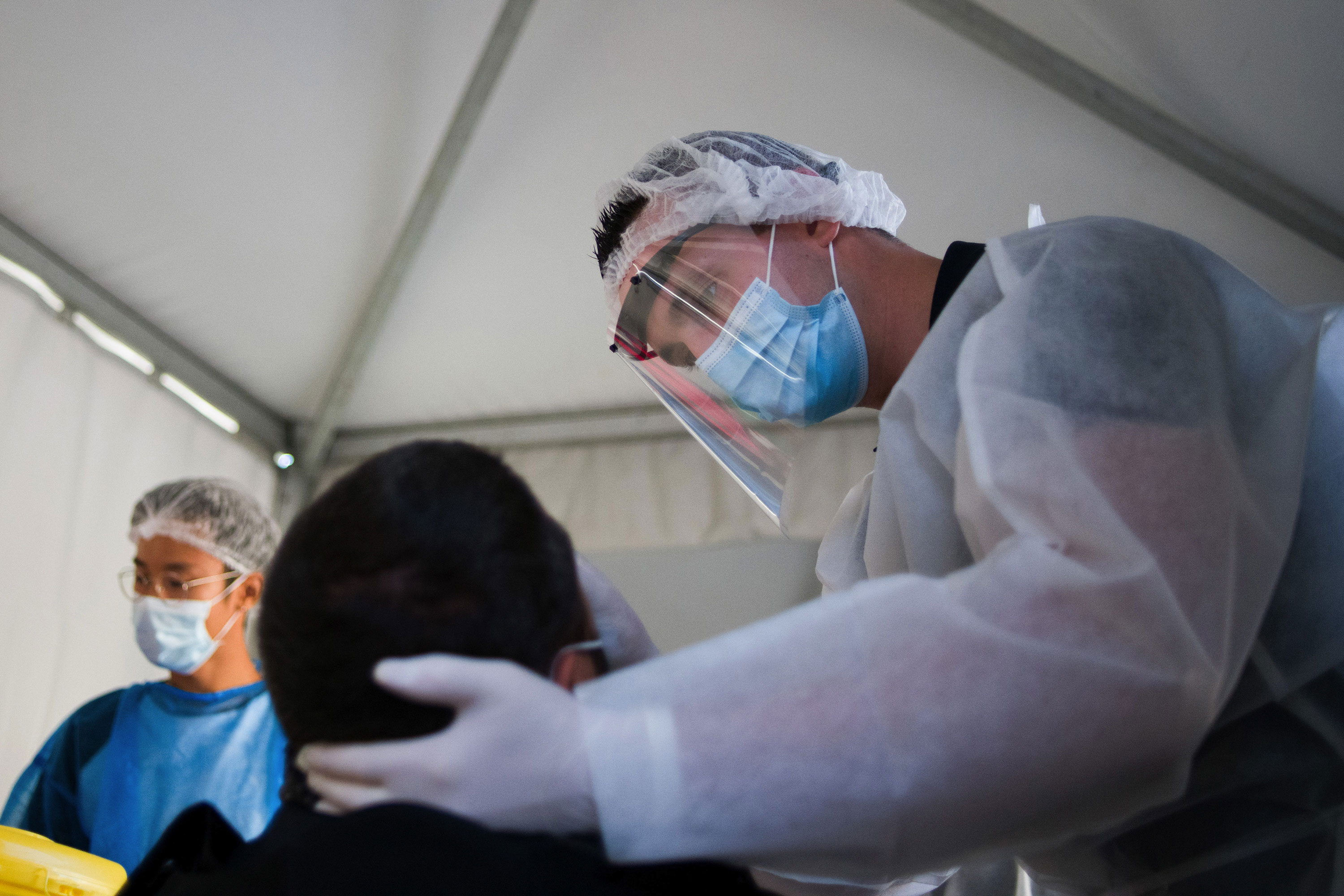 A medic administers a Covid-19 swab test on a patient in Paris on September 21.