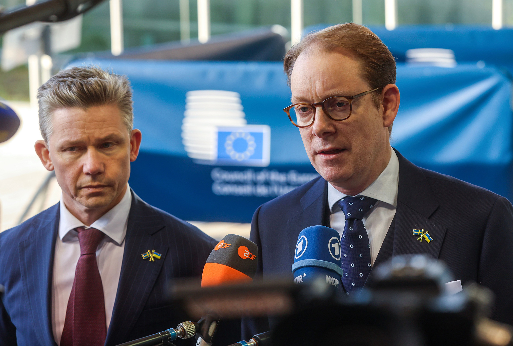 Swedish Defence Minister Pal Jonson, left, and Swedish Foreign Minister Tobias Billstrom speak to the media at the start of a European Foreign Affairs Council, in Luxembourg, on April 22. 