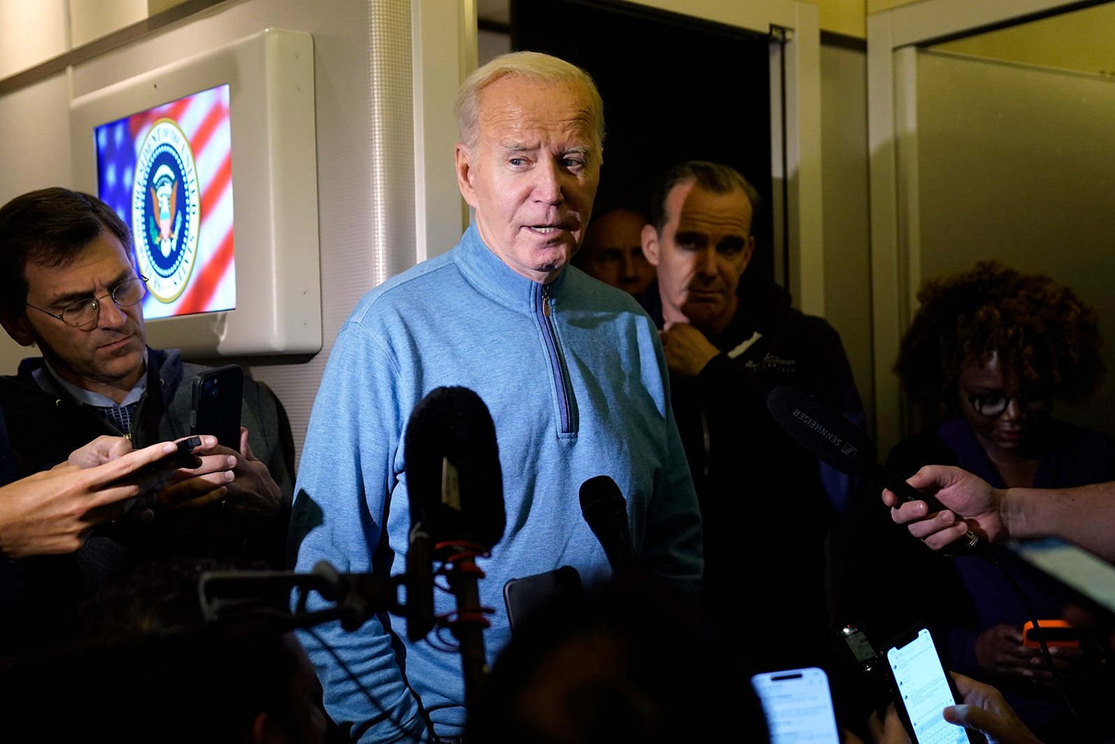 Joe Biden talks to reporters at Ramstein Air Base in Germany, on October 18, as he travels back from Israel to Washington. 