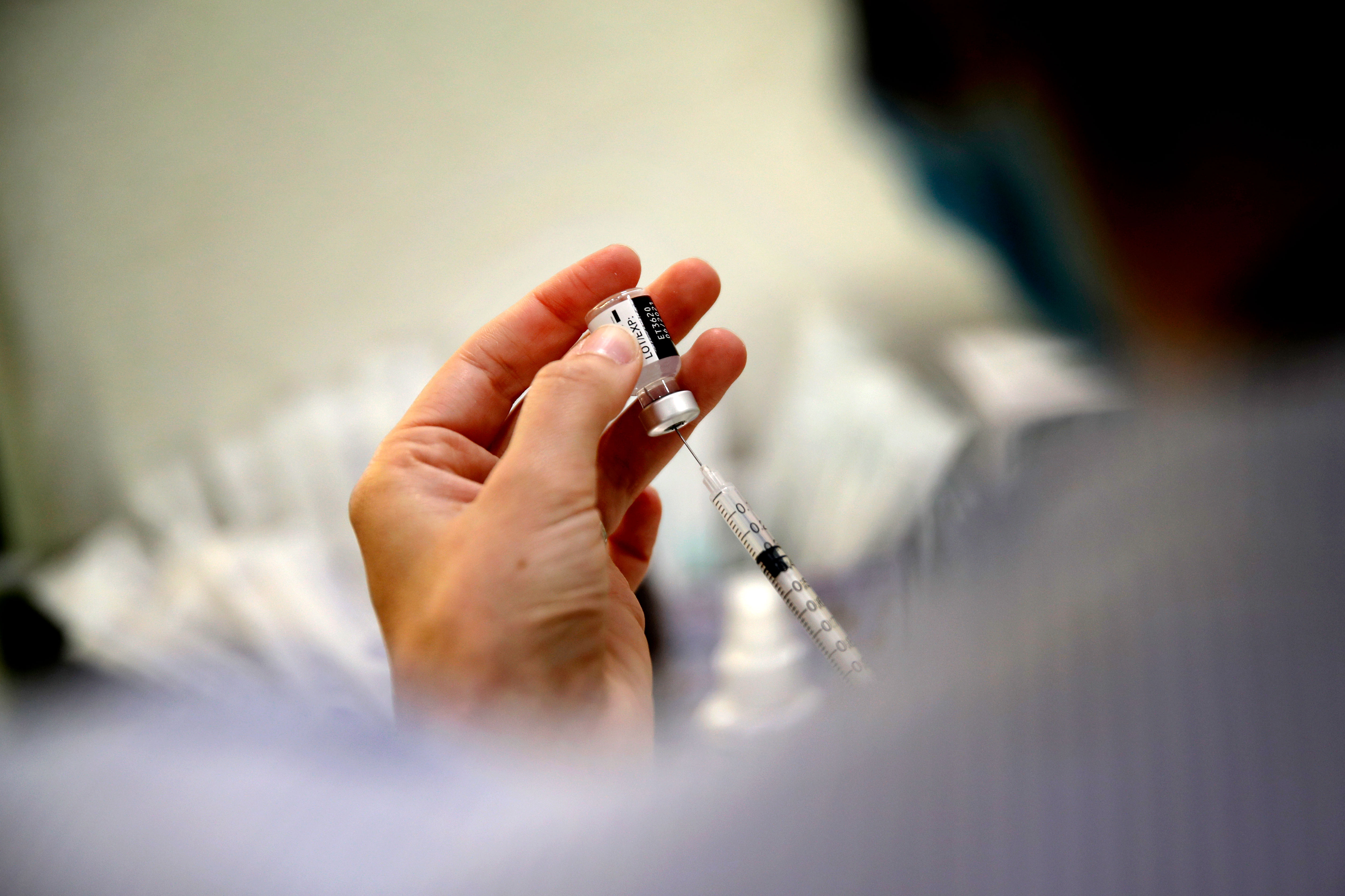 A medical staff member prepares the Pfizer Covid-19 vaccine in Boulogne-Billancourt, France, on March 19.
