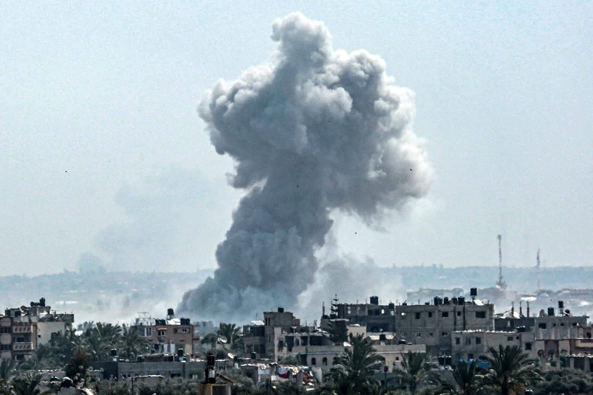 A smoke plume billows following Israeli bombardment north of Nuseirat, Gaza, on April 23. 