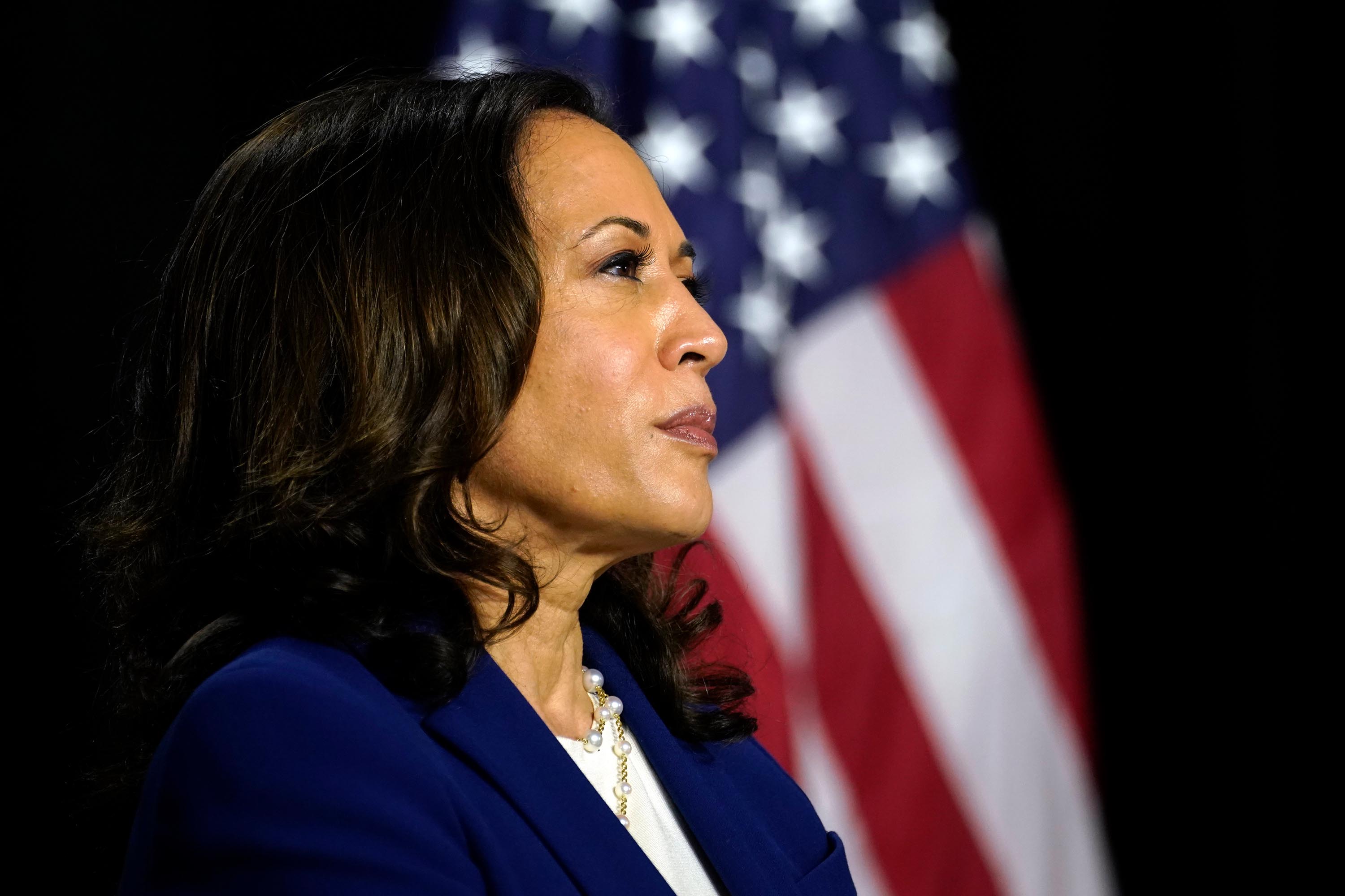 Sen. Kamala Harris listens to former Vice President Joe Biden in Wilmington, Delaware, on Aug. 12. 