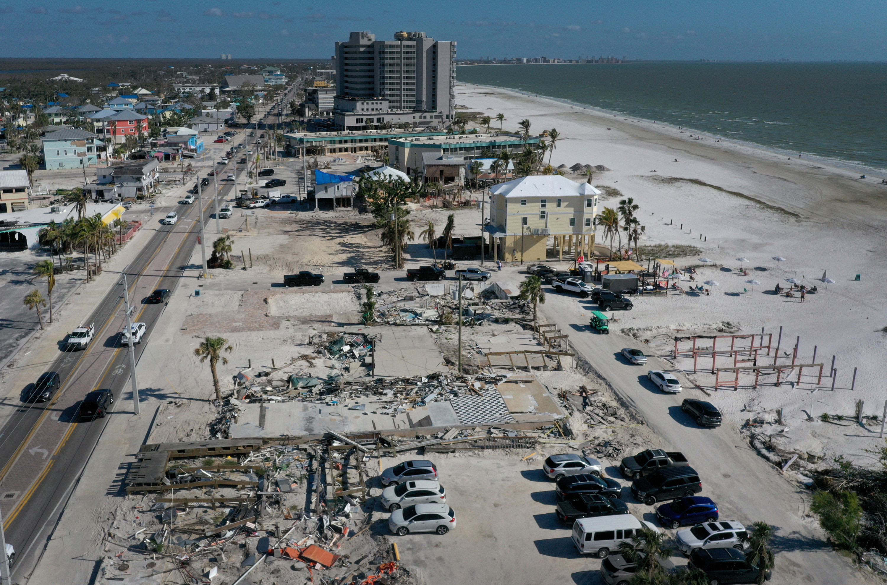 In this aerial view, cleared lots are all that remain of some homes and businesses that were destroyed by Hurricane Ian on January 25, 2023 in Fort Myers Beach, Florida.