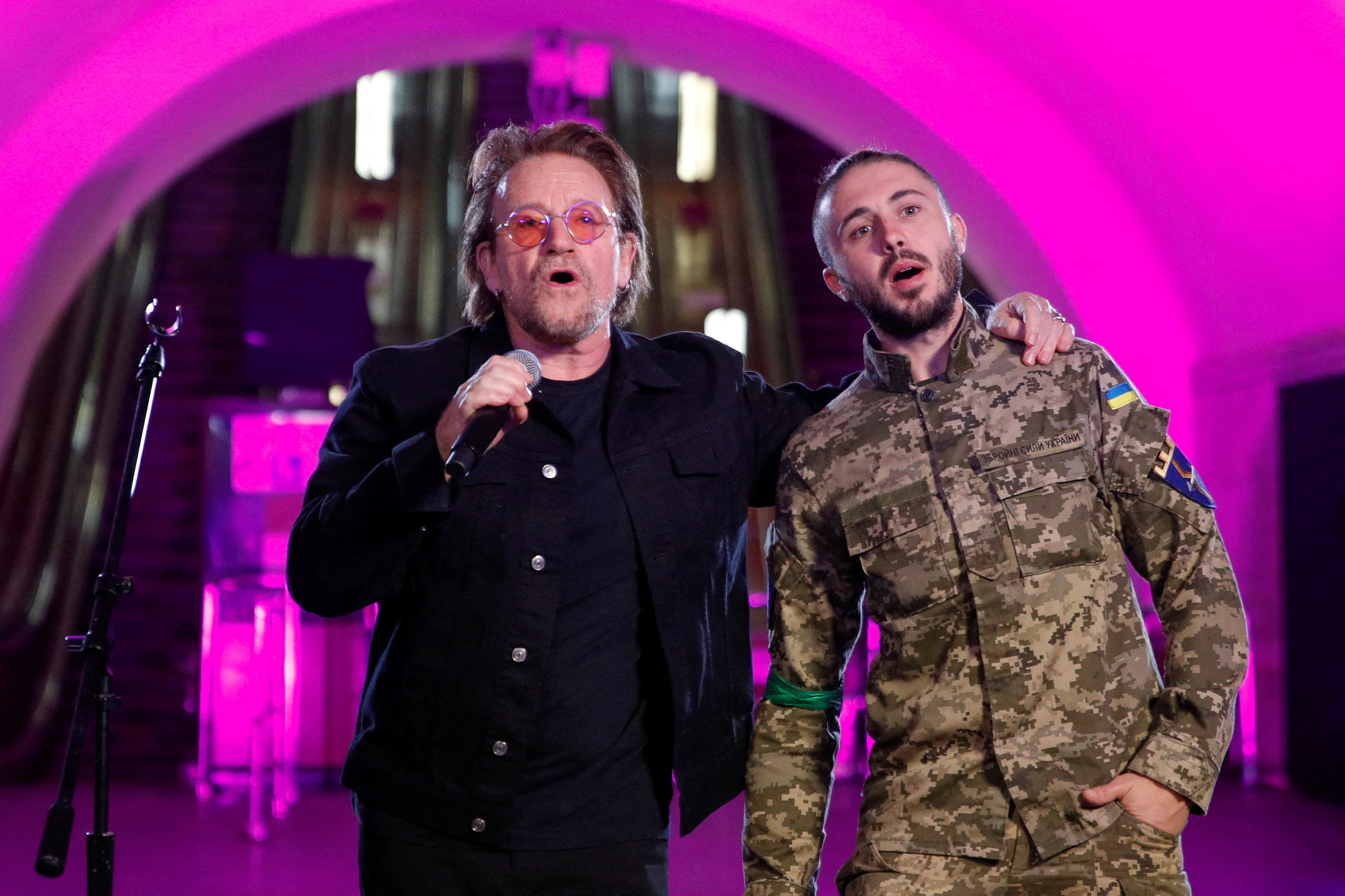 U2’s Bono sings with Taras Topolia, the singer of Ukrainian pop-rock band Antytila, inside a metro station in Kyiv, Ukraine, on Sunday, May 8. 