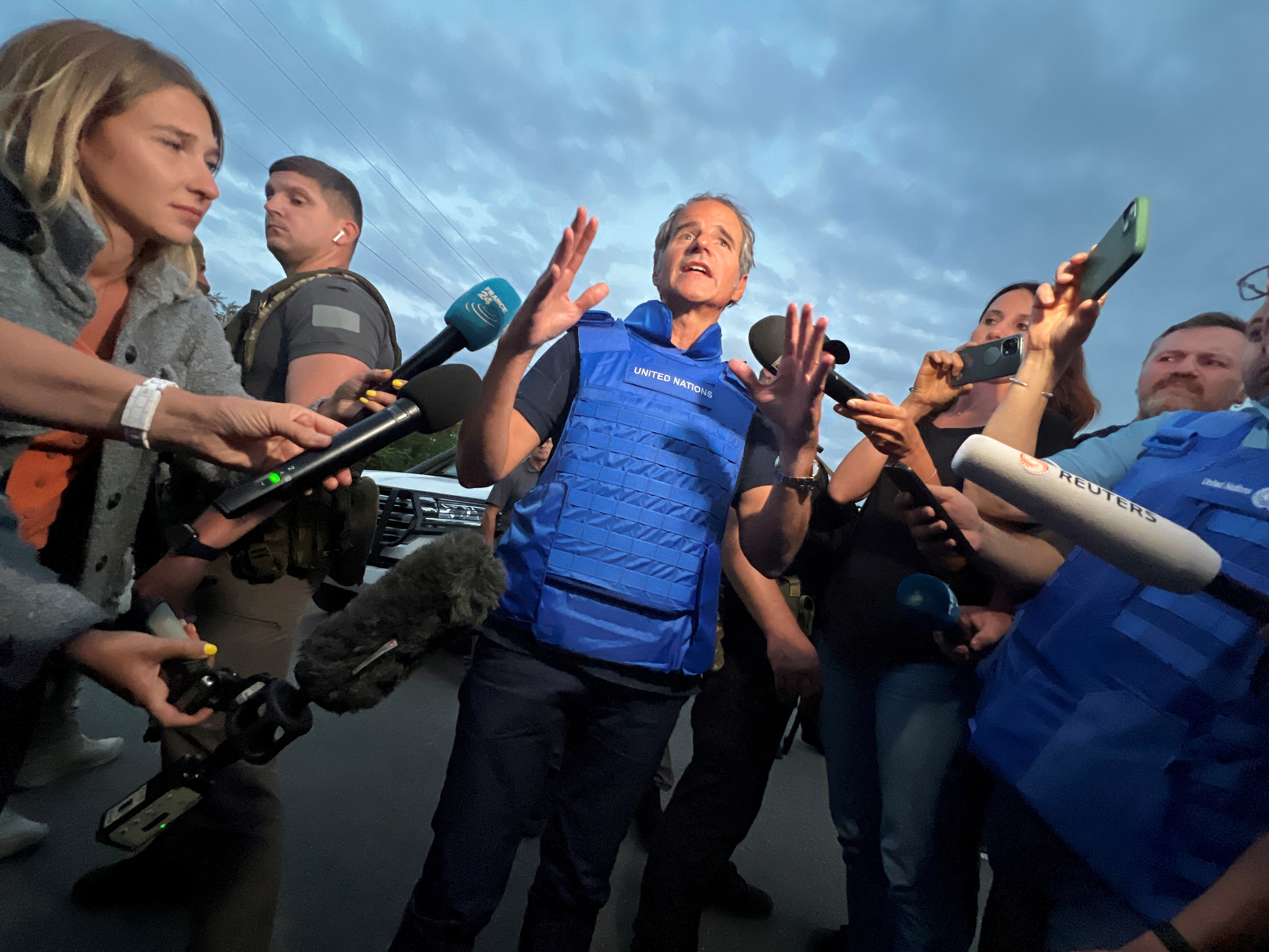 IAEA Director General Rafael Mariano Grossi speaks with journalists at a Ukrainian checkpoint after a part of the International Atomic Energy Agency (IAEA) mission came back from a Zaporizhzhia nuclear power plant on September 1.