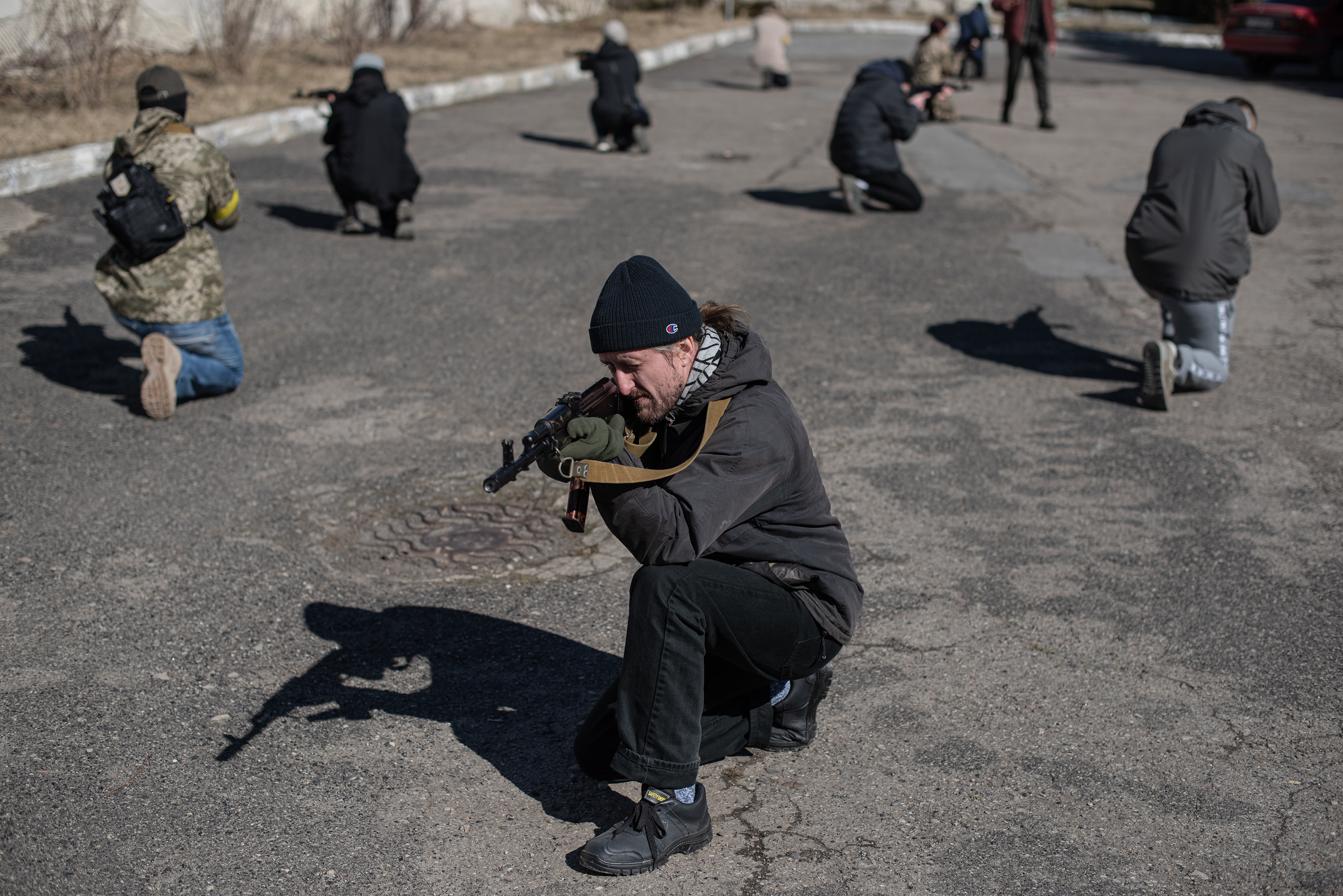 Civilians practice moving in groups at a military training exercise in Ivano-Frankivsk, Ukraine on March 11.