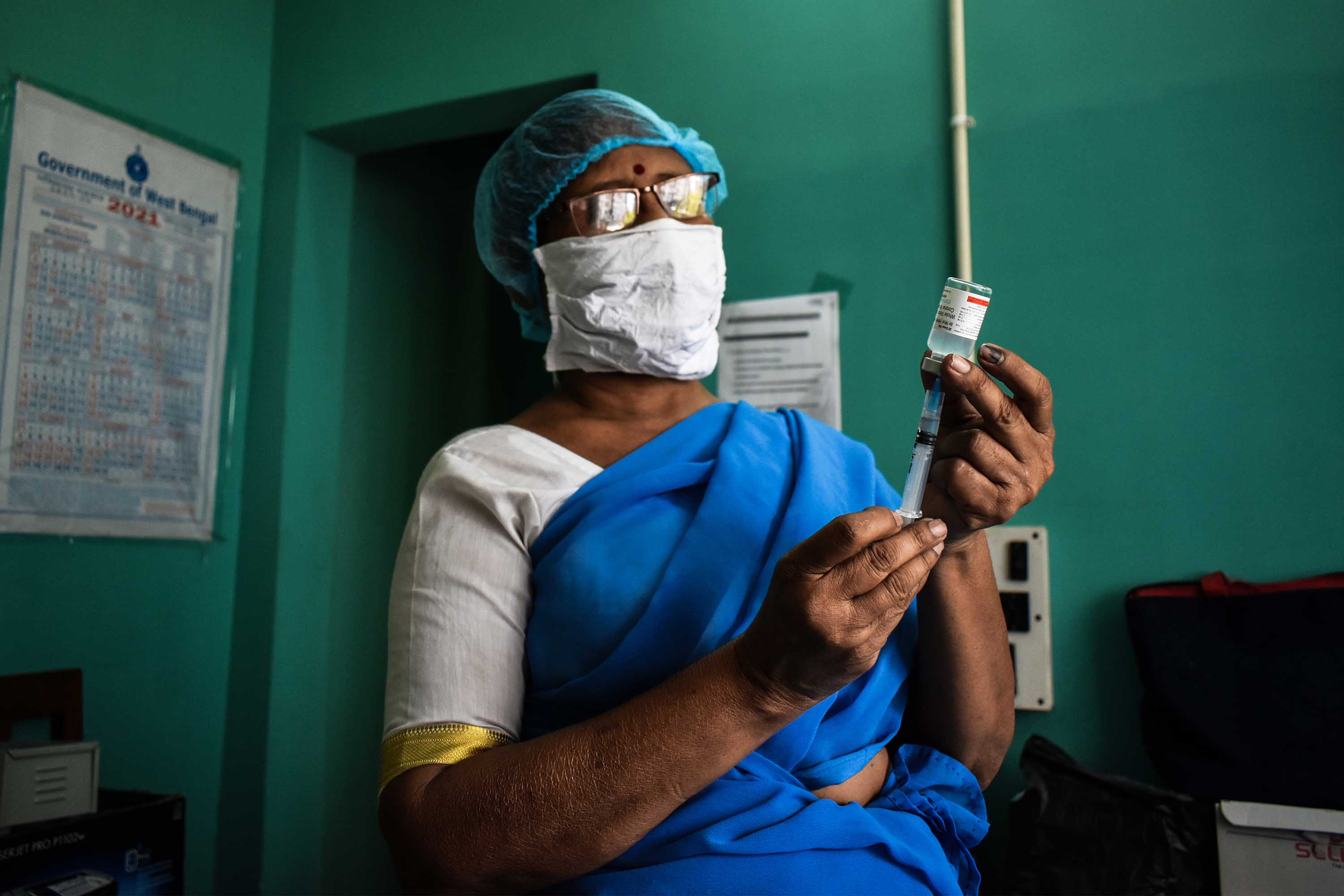 A health worker prepares a dose of the Covaxin vaccine at a vaccination center in Kolkata, India, on April 24. 