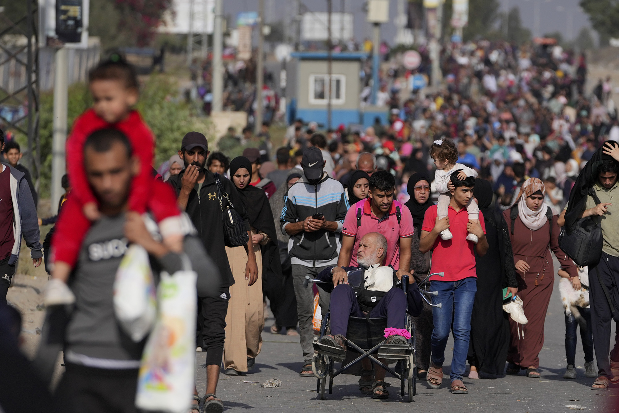 Palestinians flee to the south on Salah al-Din Street in Bureij, Gaza, on November 8.