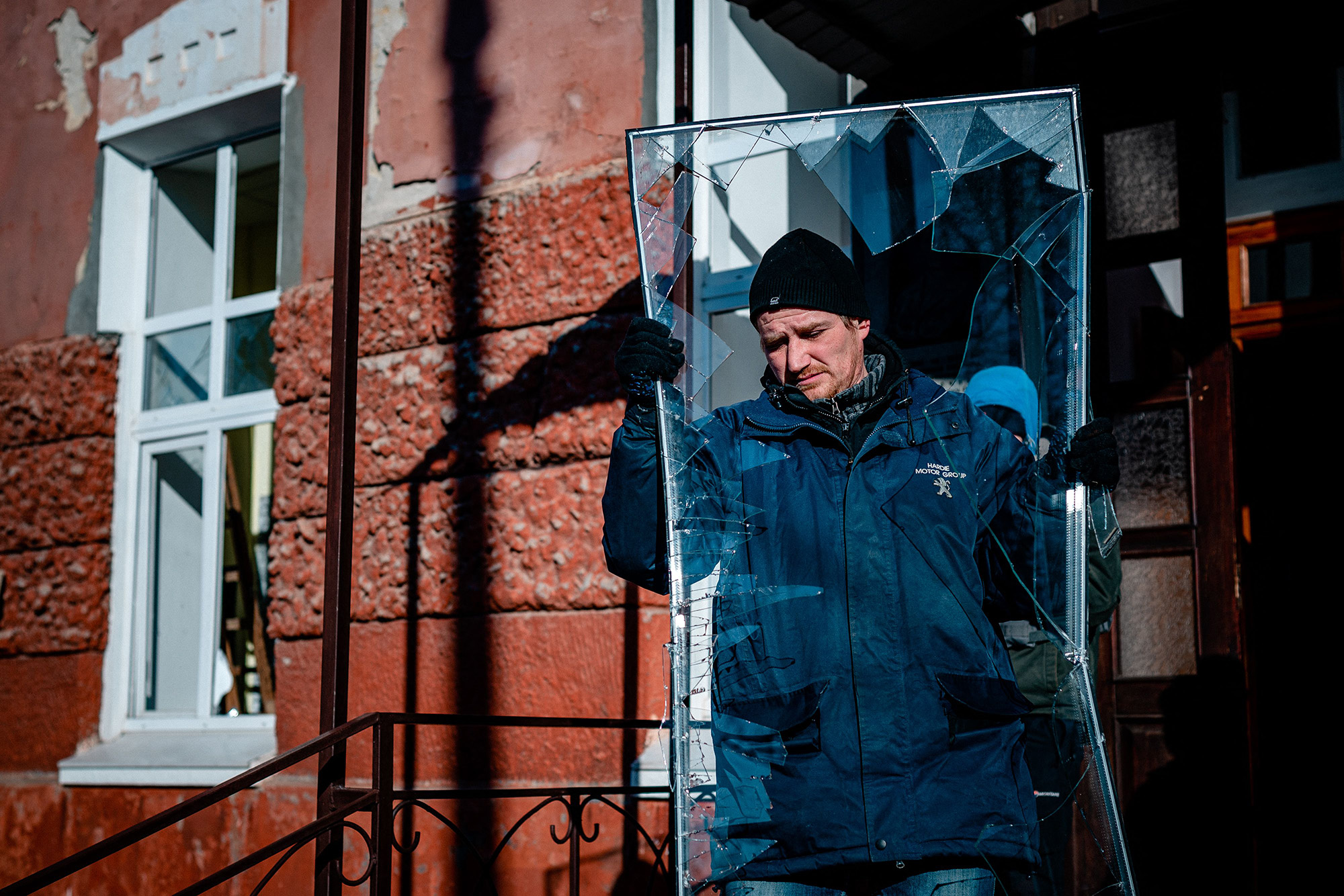 A worker cleans up debris after Russian shelling of the hospital maternity unit in Kherson, Ukraine, on December 28.