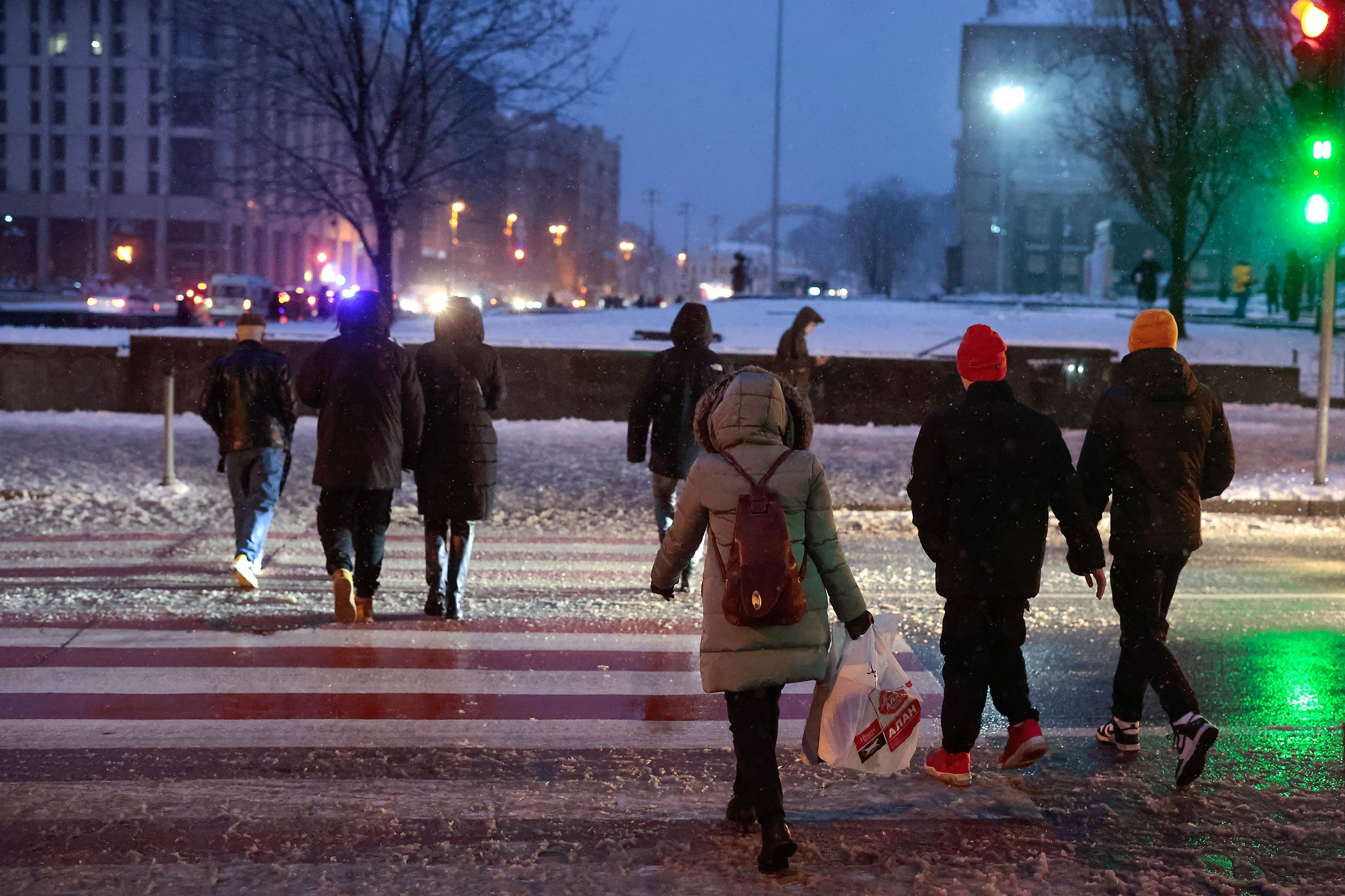Pedestrians cross a street in Kyiv, Ukraine, on November 27.