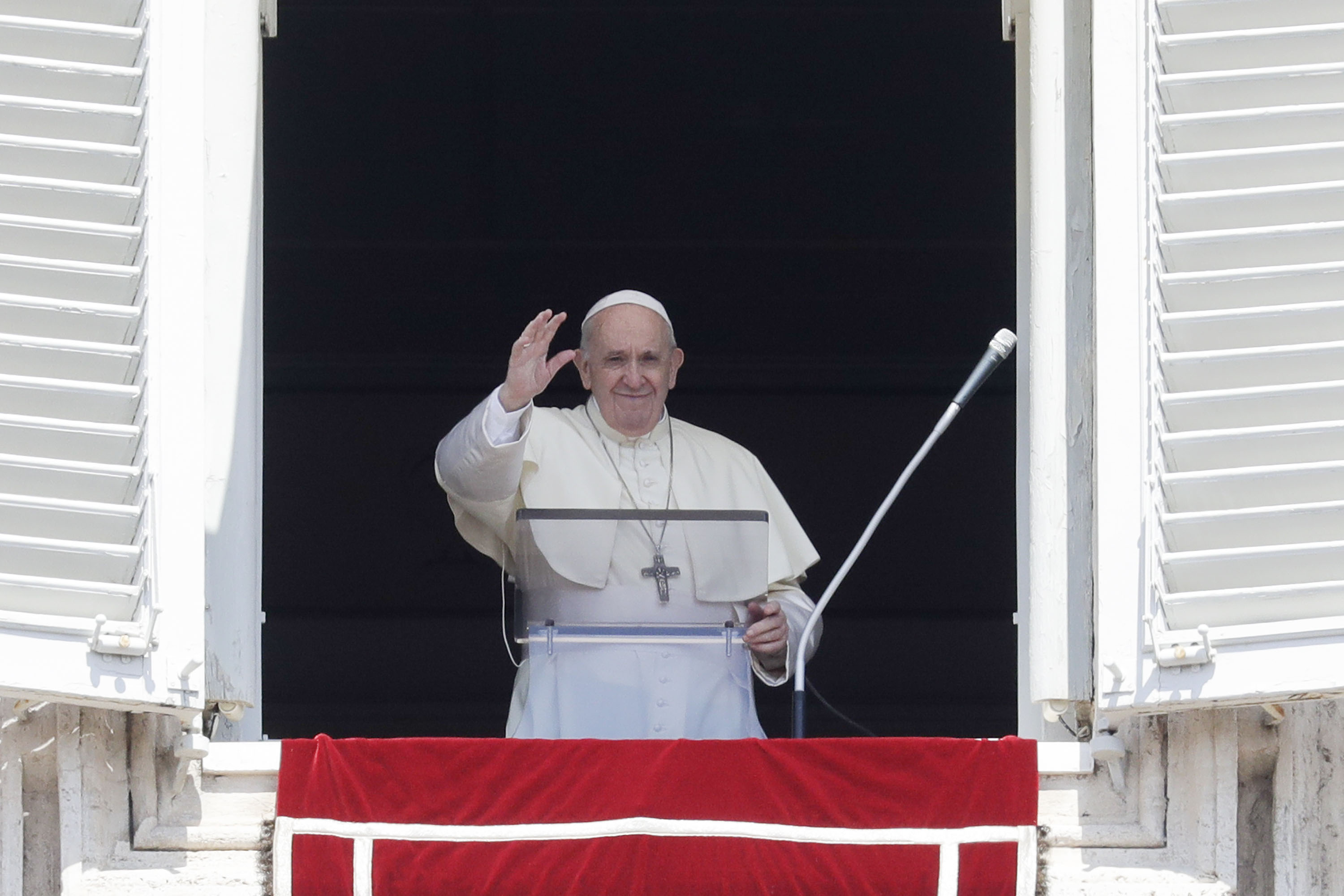 Pope Francis is pictured on August 15, as he delivers his blessing from the window of his studio overlooking St. Peter's Square, at the Vatican.