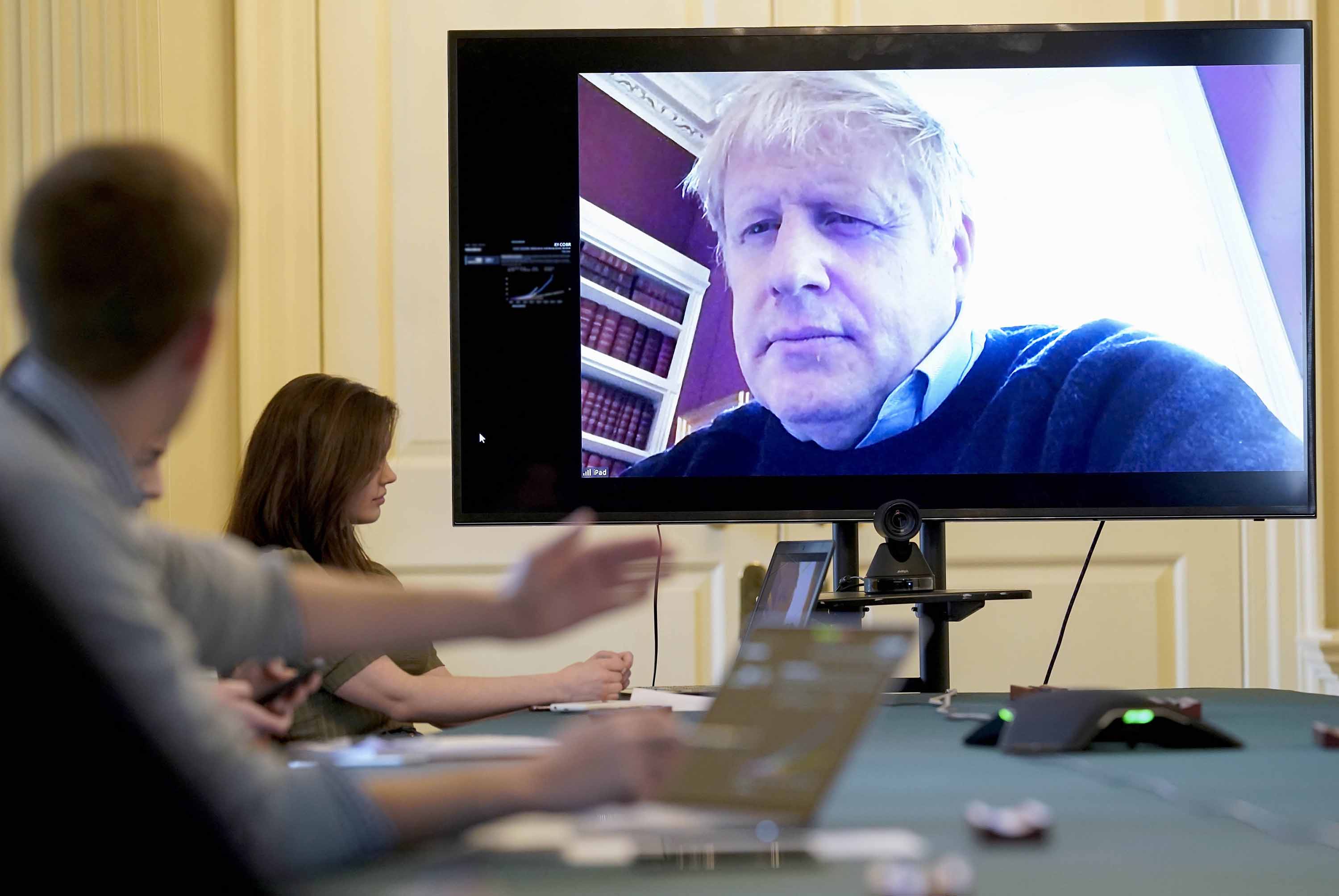 Britain's Prime Minister Boris Johnson chairs the morning Covid-19 Meeting remotely on Saturday, March 28, after testing positive for the virus.