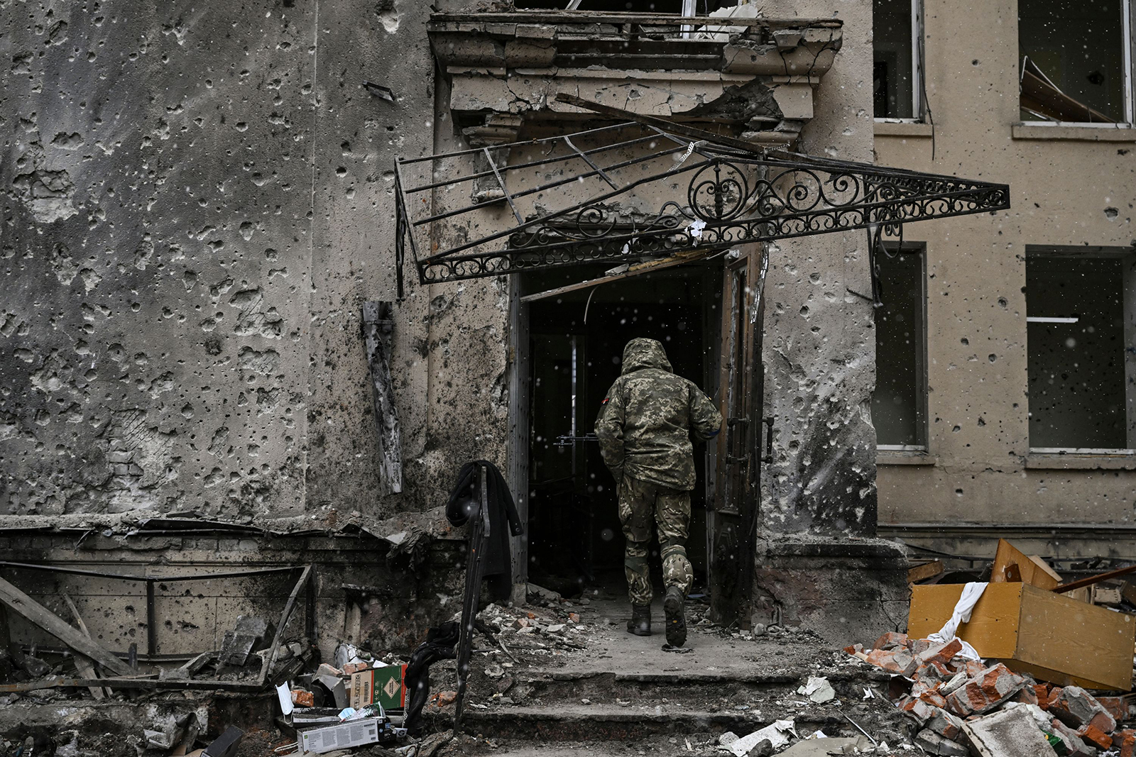 A Ukranian serviceman enters the destroyed regional headquarters of Kharkiv, Ukraine on March 27.
