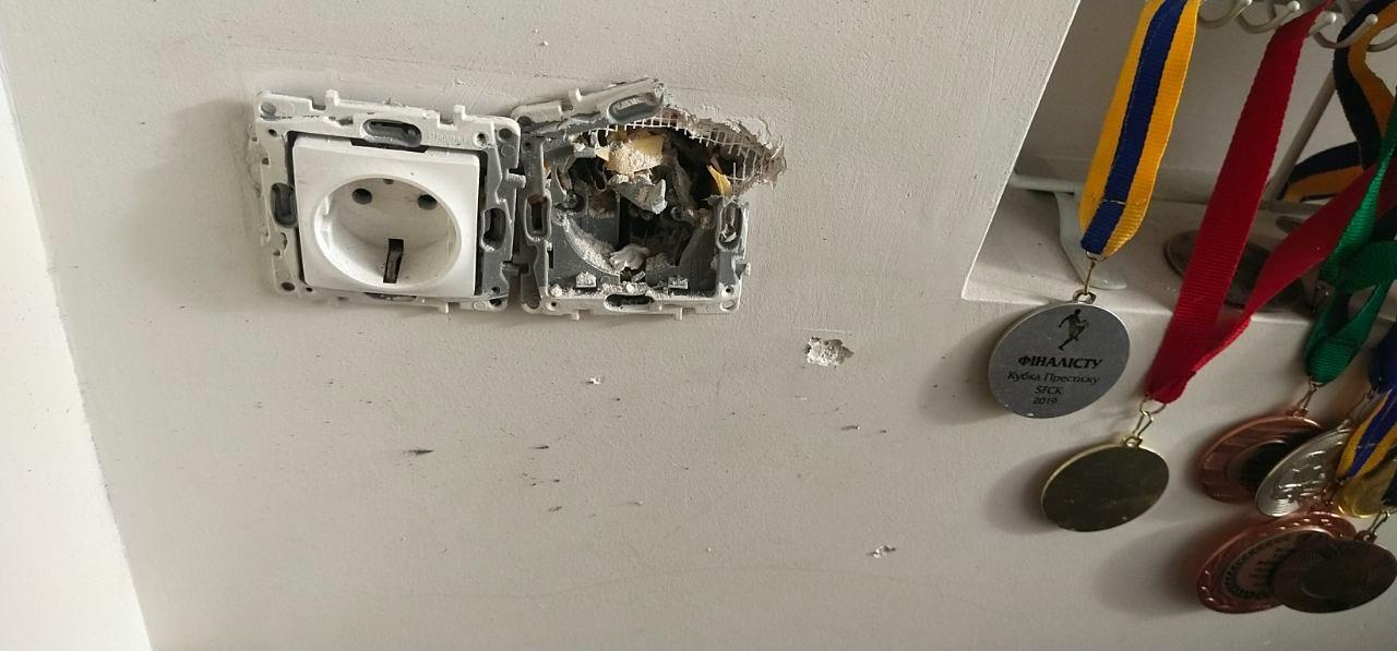 Damage to an electrical plug in the apartment.
