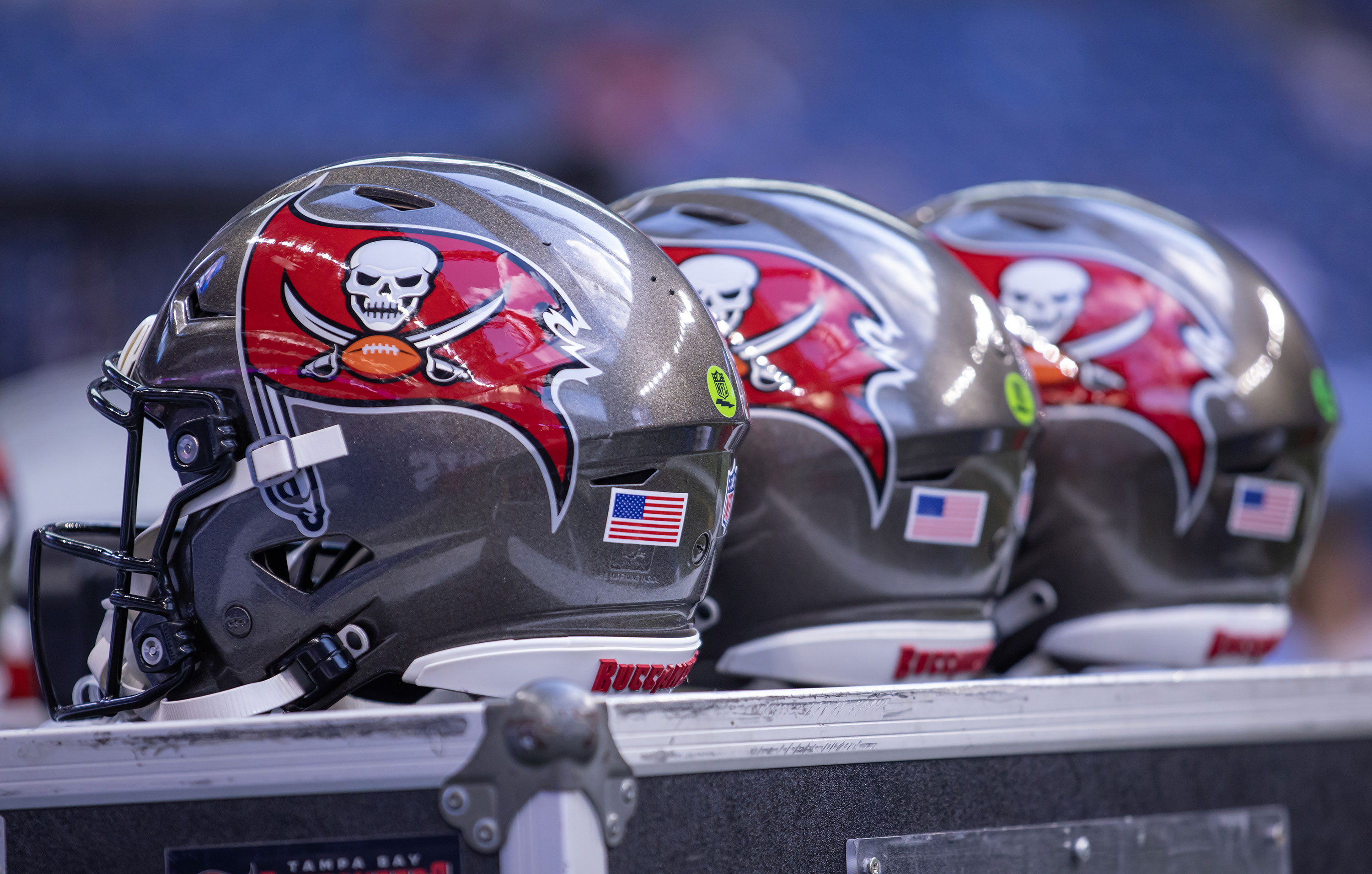 Tampa Bay Buccaneers helmets sit on the sidelines during a preseason game in August 27.