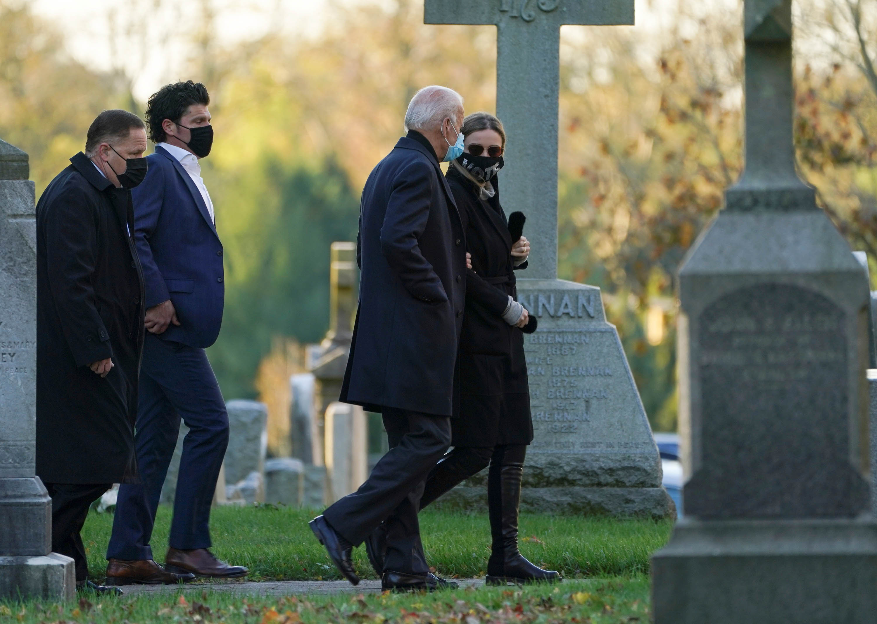 US Democratic presidential candidate Joe Biden walks with granddaughter Finnegan as he attends church on election day in the Wilmington area on Tuesday, November 3.