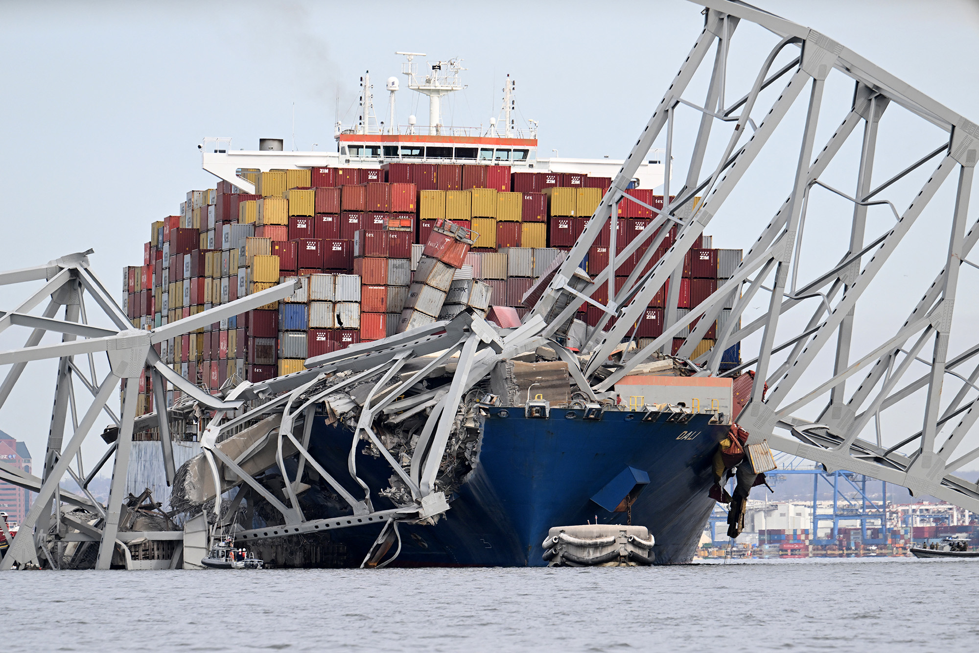 The steel frame of the Francis Scott Key Bridge sits on top of the container ship Dali after the bridge collapsed, Baltimore, Maryland, on March 26,
