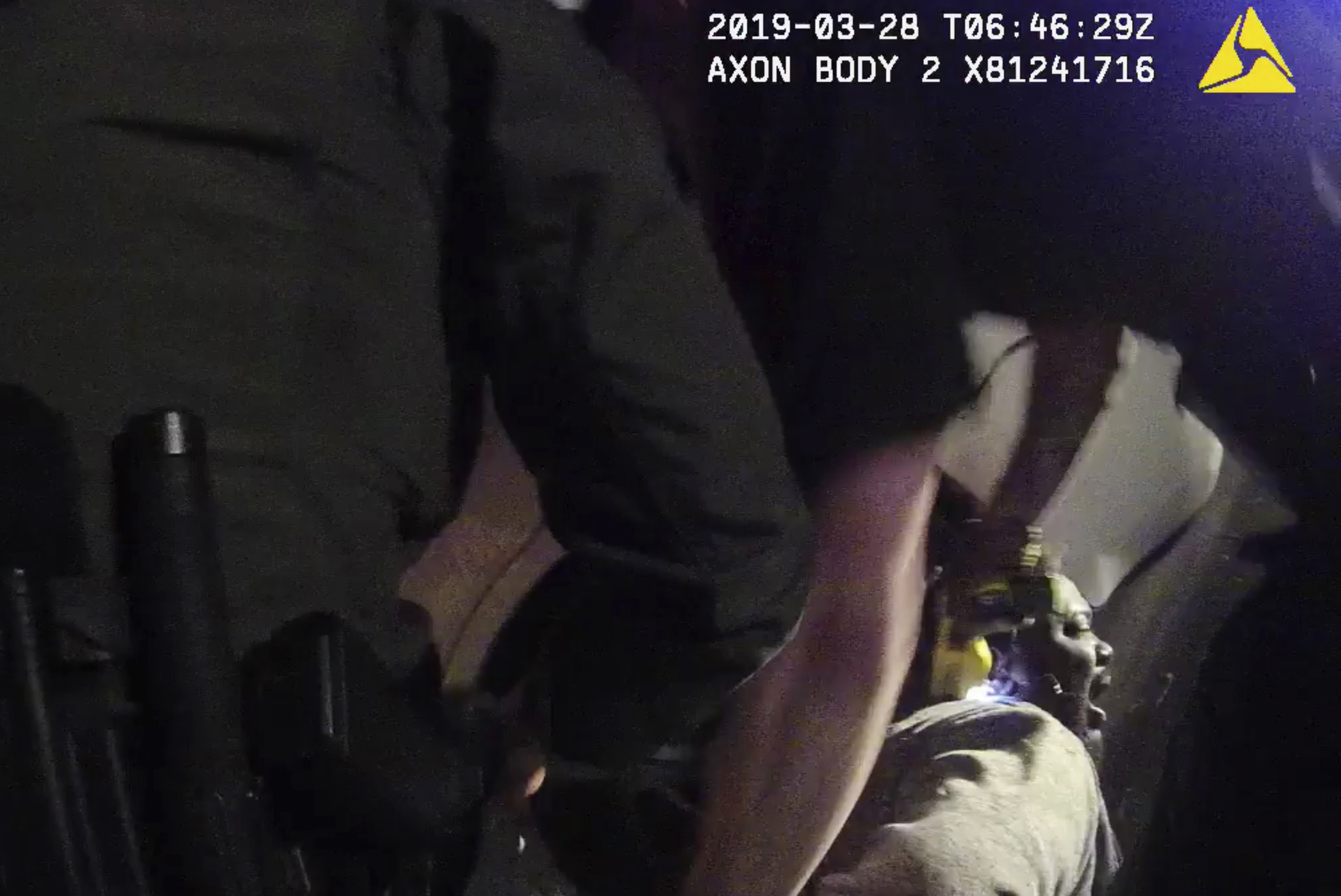 In this image from a March 28, 2019, body-worn camera video provided by the Austin Police Department in Texas, Williamson County deputies hold down Javier Ambler as one of them uses a Taser on Ambler's back during his arrest. 