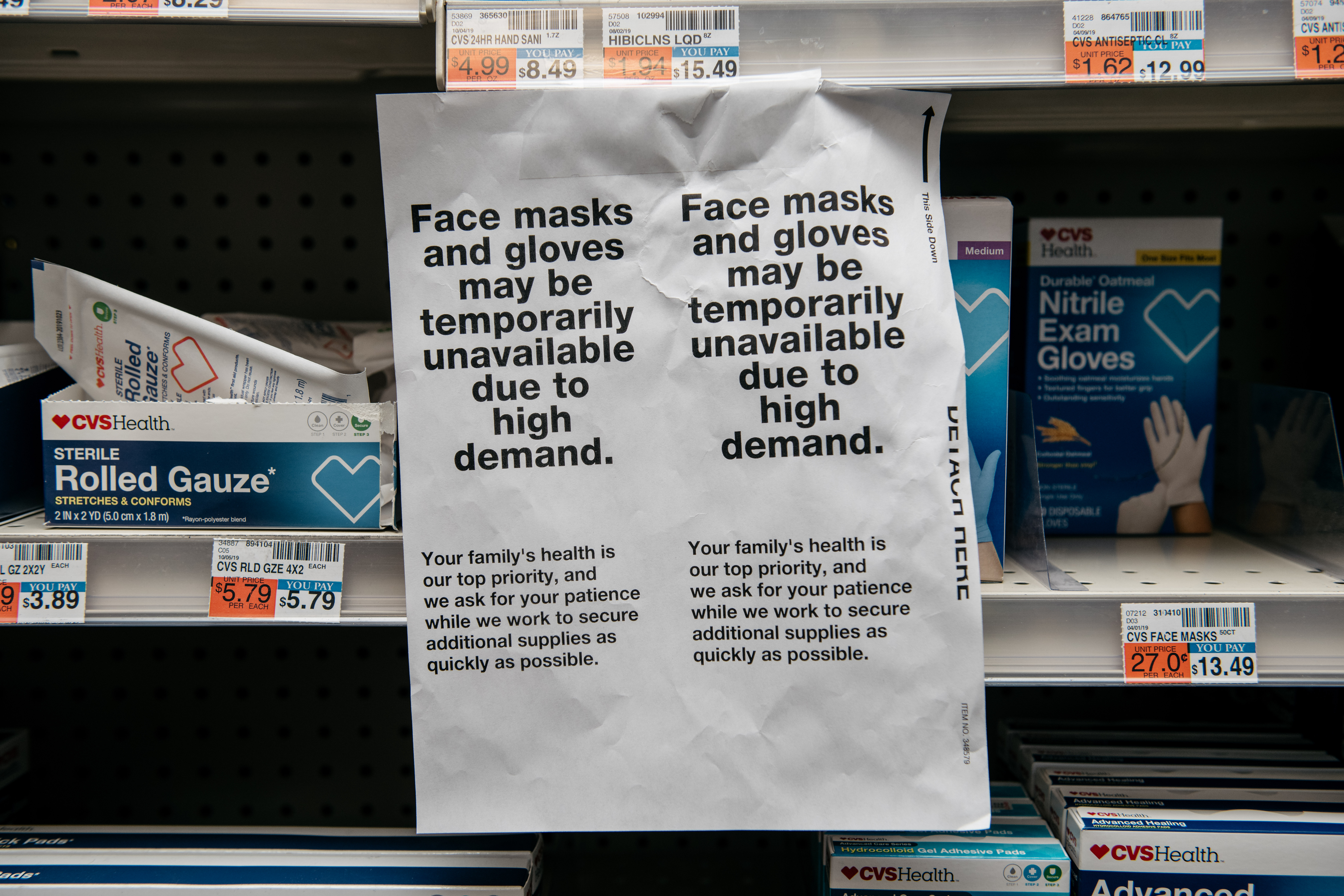 Signs for sold out facemasks are posted in a Manhattan pharmacy on Wednesday, February 26.
