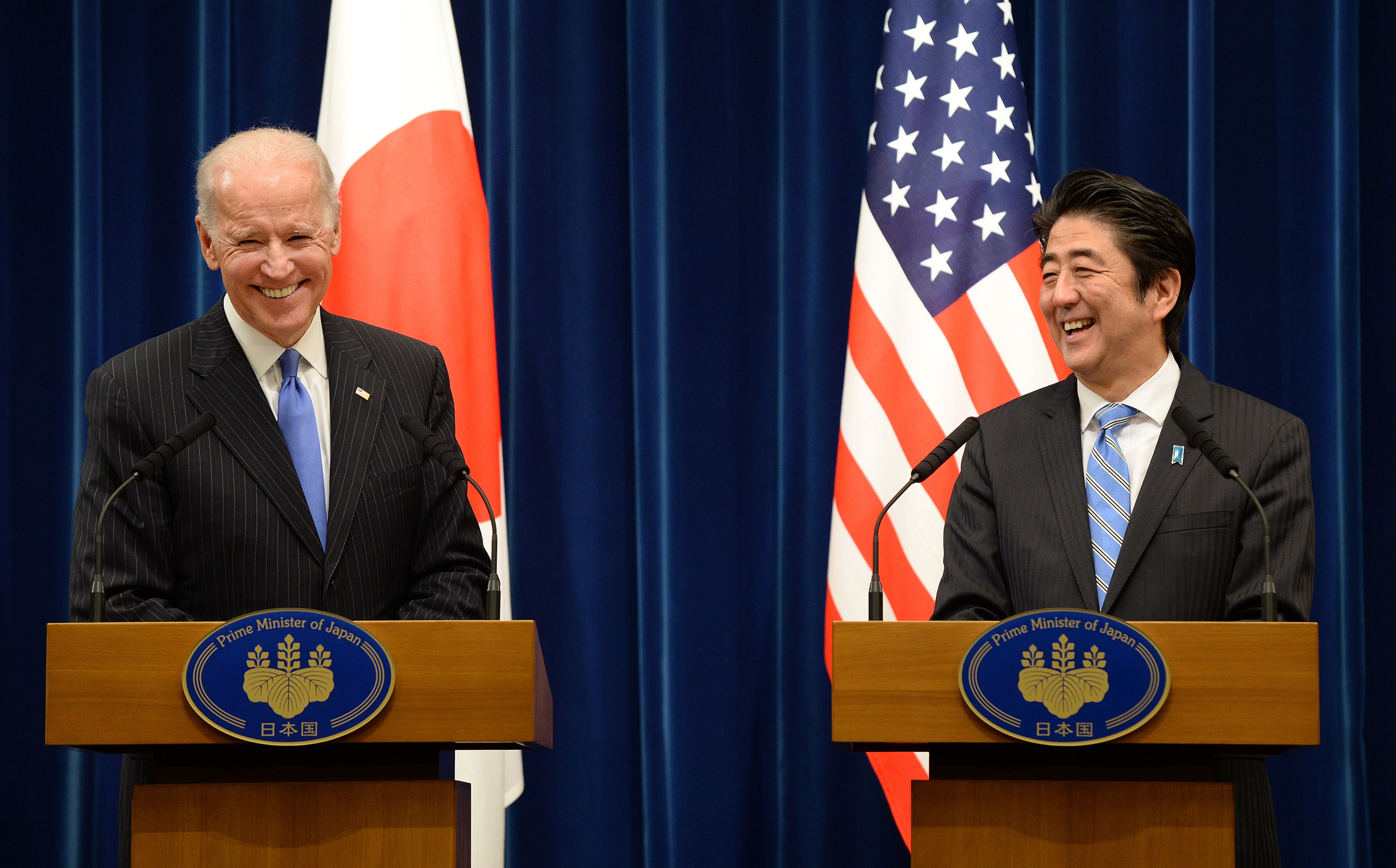 Then US Vice President Joe Biden, left, shares a laugh with Japanese Prime Minister Shinzo Abe during a joint press conference after their meeting at Abe's official residence in Tokyo, Japan, on December 3, 2013.