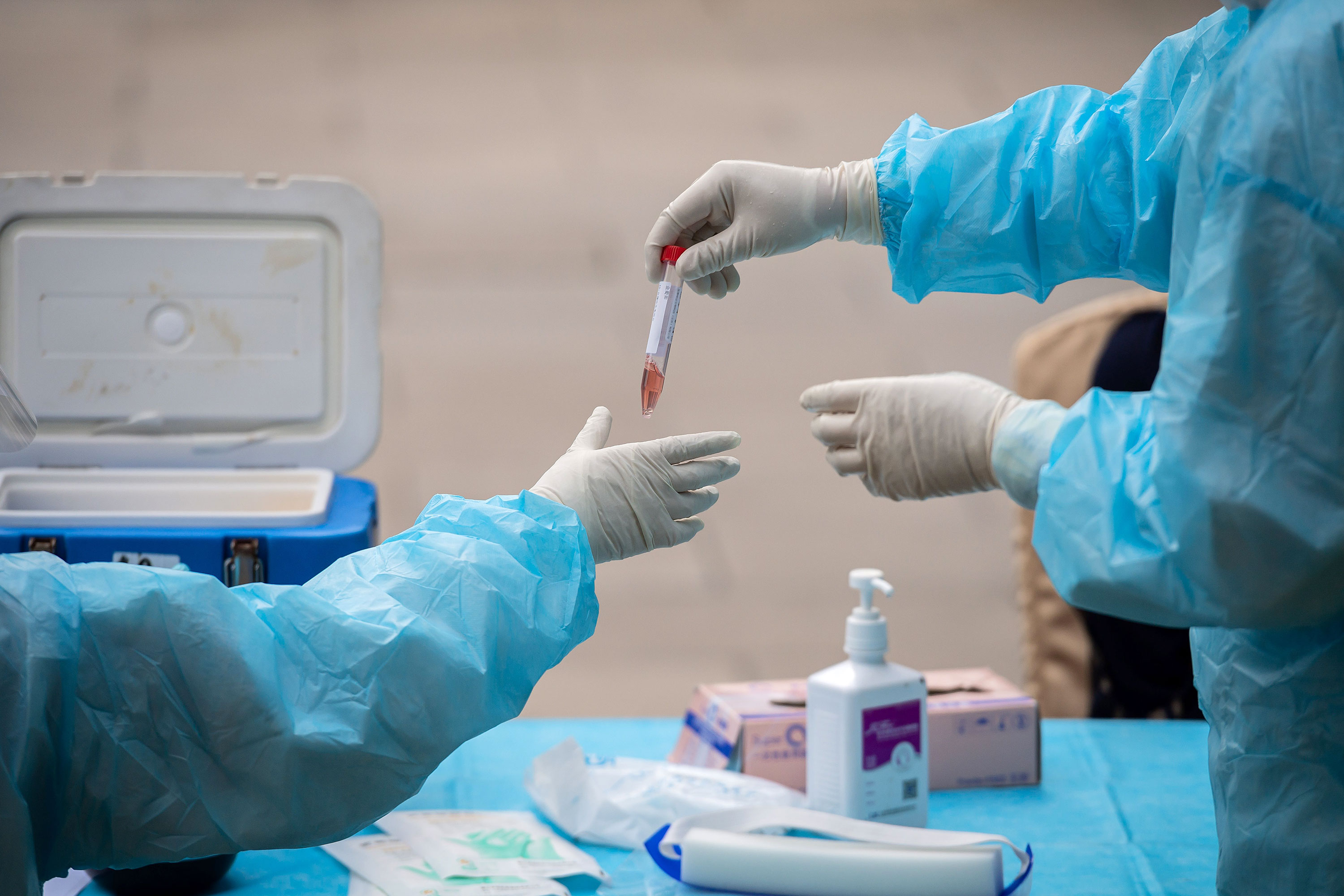 Medical workers take coronavirus test swabs in Beijing on May 28.