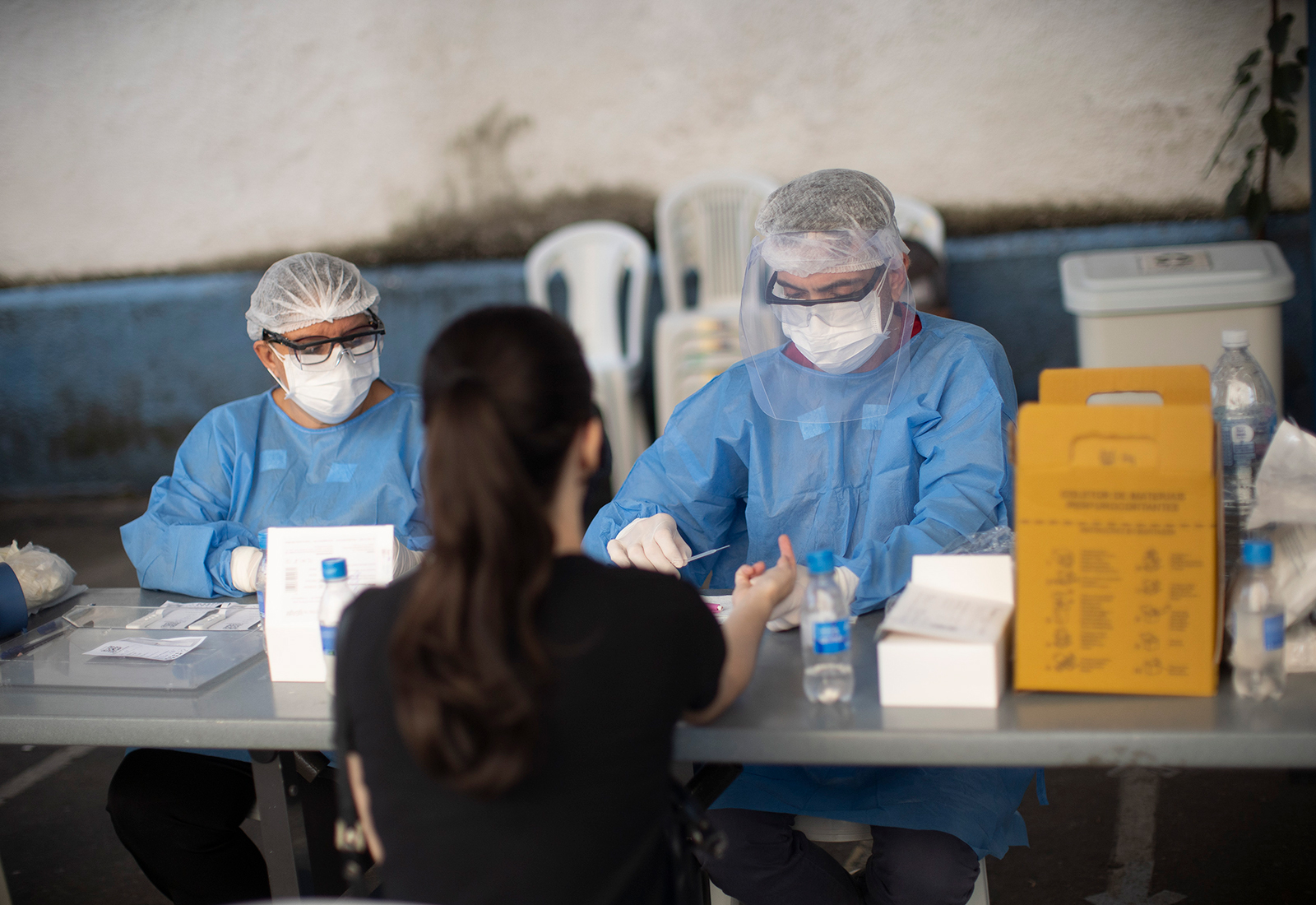 Health workers take residents' blood samples at a testing site for Covid-19 in Rio de Janeiro, Brazil, on Friday, July 17. 