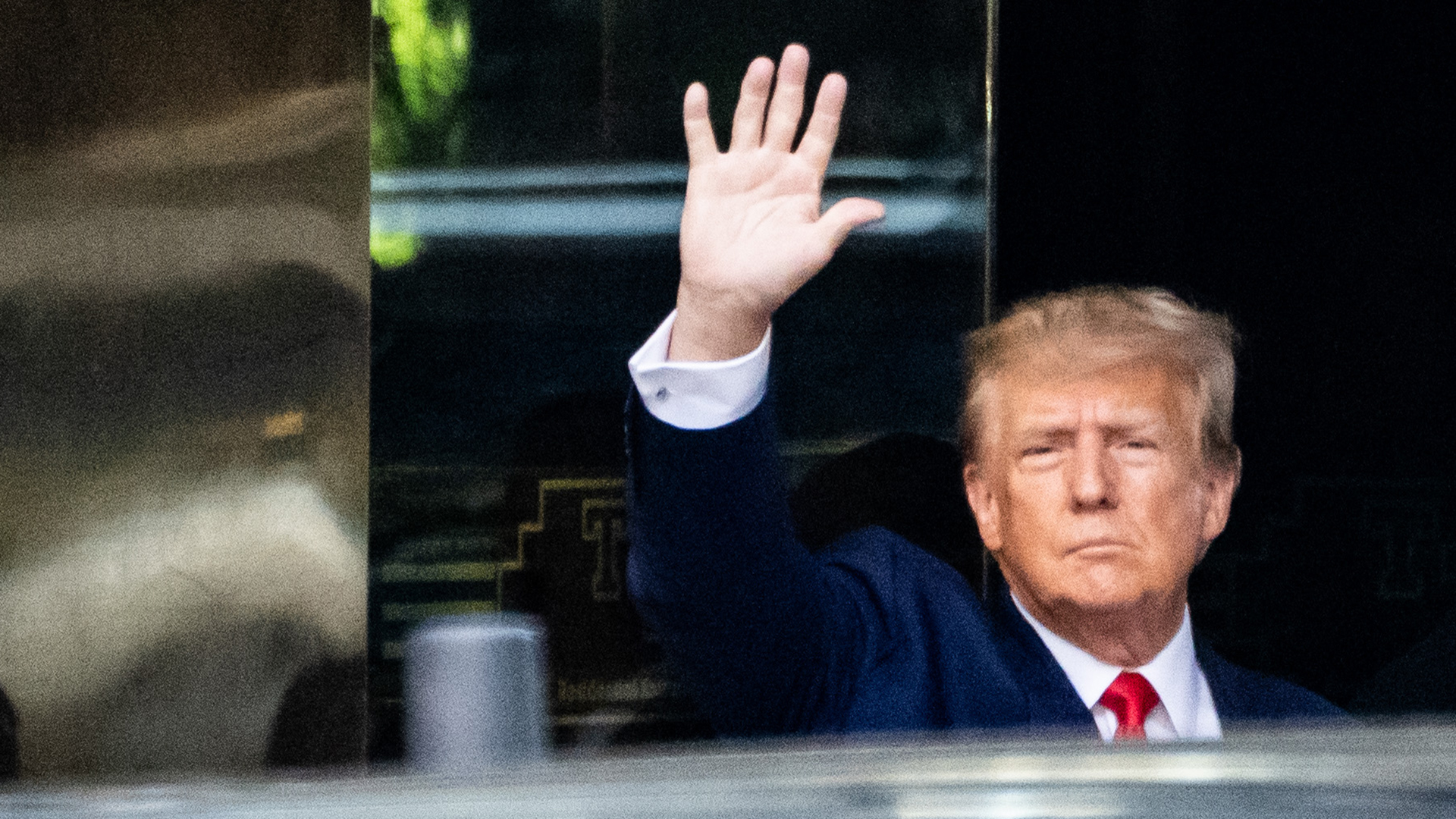 Former President Donald Trump leaves Trump Tower to head to the New York Criminal Court where he will be arraigned on charges on Tuesday.