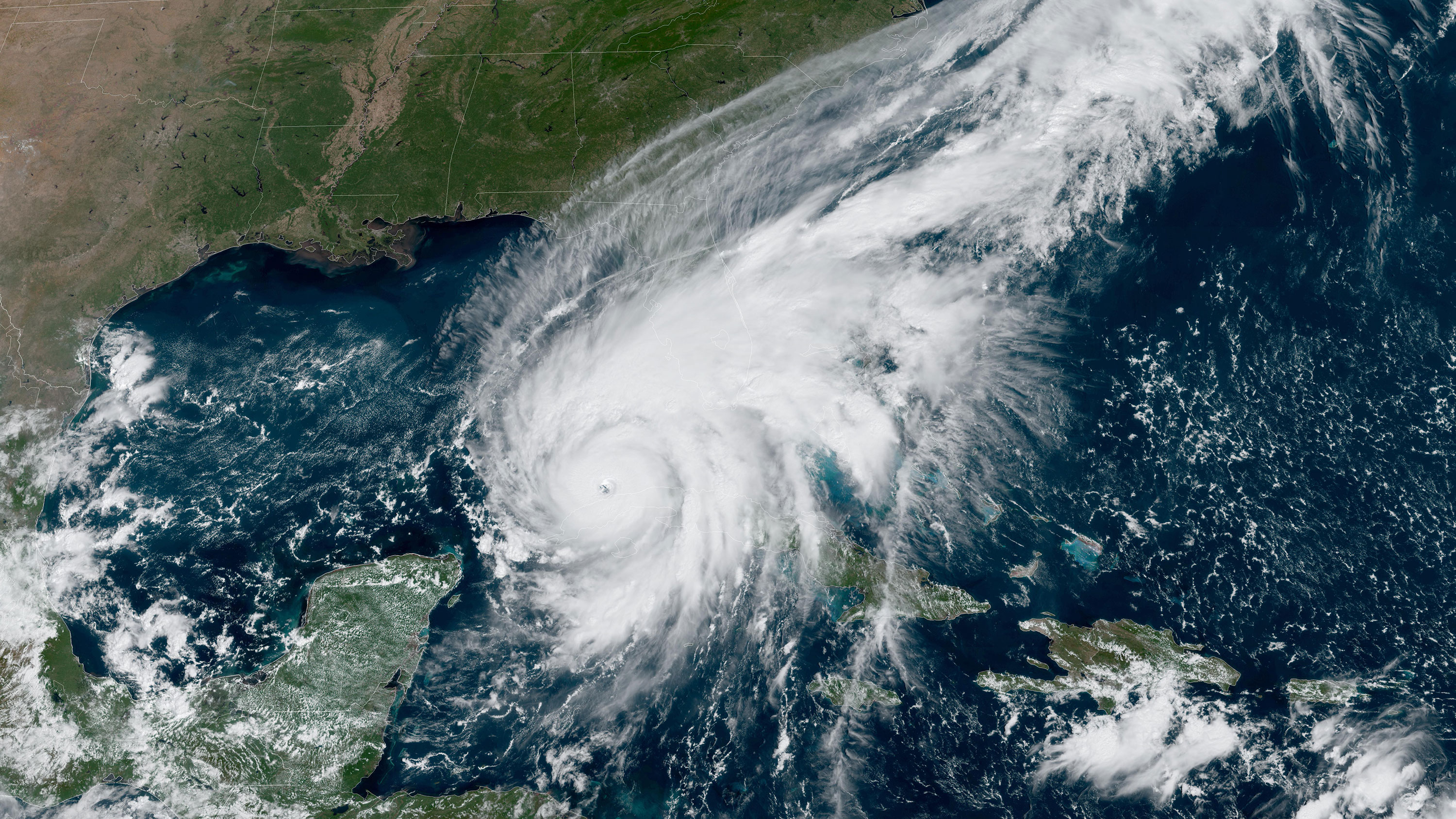 A satellite image taken at 12:01 p.m. ET shows Hurricane Ian over the Gulf of Mexico.