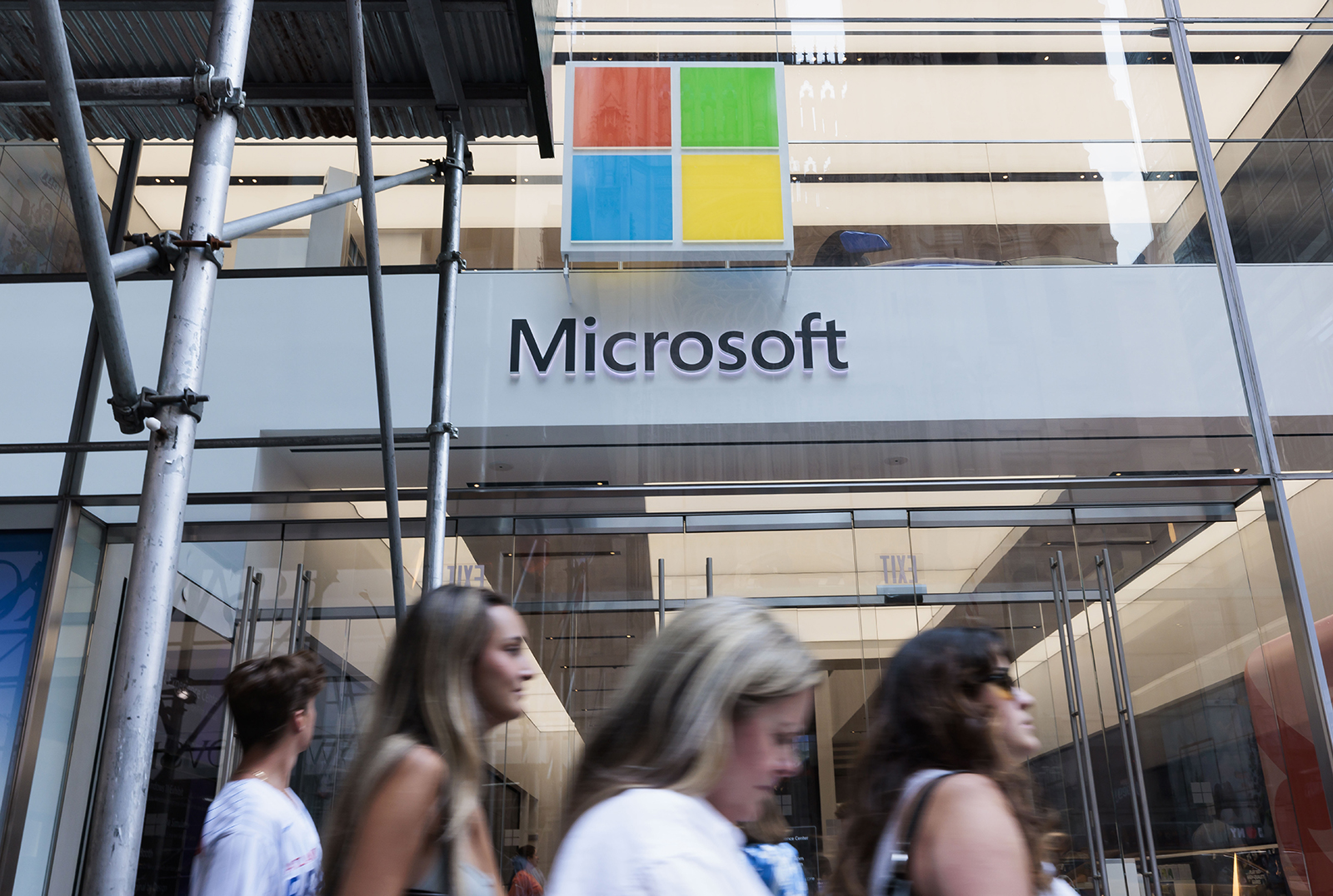 People walk past a Microsoft store in New York, NY, on July 11.