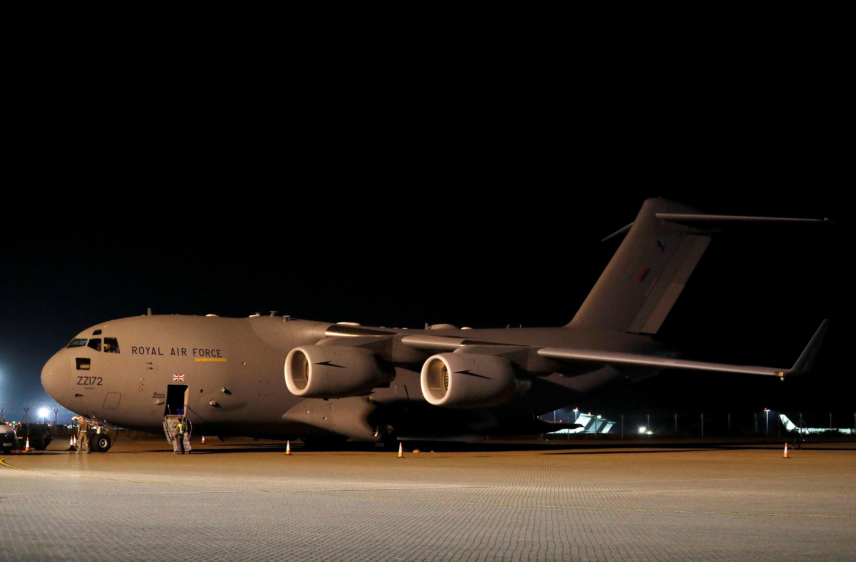British military personnel depart a C-17 aircraft at Royal Air Force Brize Norton, Oxfordshire, late Sunday, August 29. The final UK troops and diplomatic staff were airlifted from Kabul on Saturday, drawing to a close Britain's 20-year engagement in Afghanistan and a two-week operation to rescue UK nationals and Afghan allies.