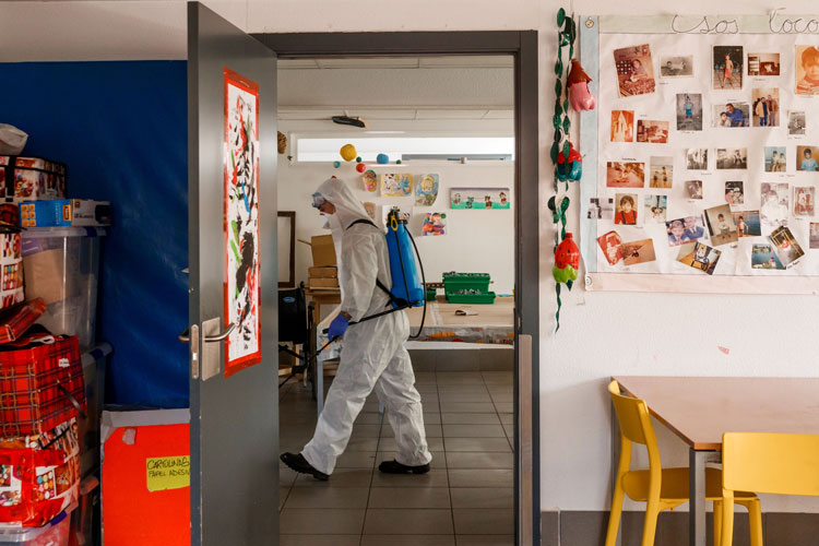 A member of the Military Emergencies Unit carries out a general disinfection at the Apanid residence for people with physical and intellectual disabilities in the Getafe suburb of Madrid on March 25 amid a national lockdown to fight the spread of the coronavirus. 