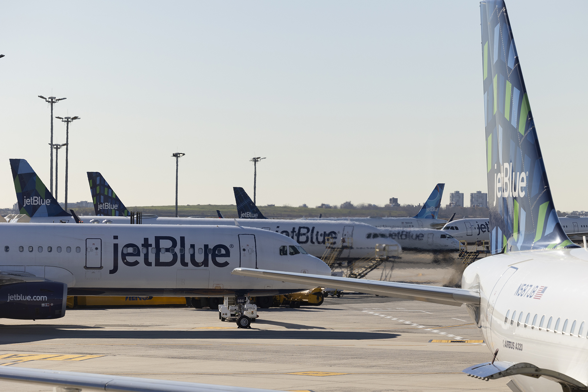 JetBlue planes at John F. Kennedy International Airport (JFK) in New York, U.S., on Wednesday, Nov. 24, 2021. 