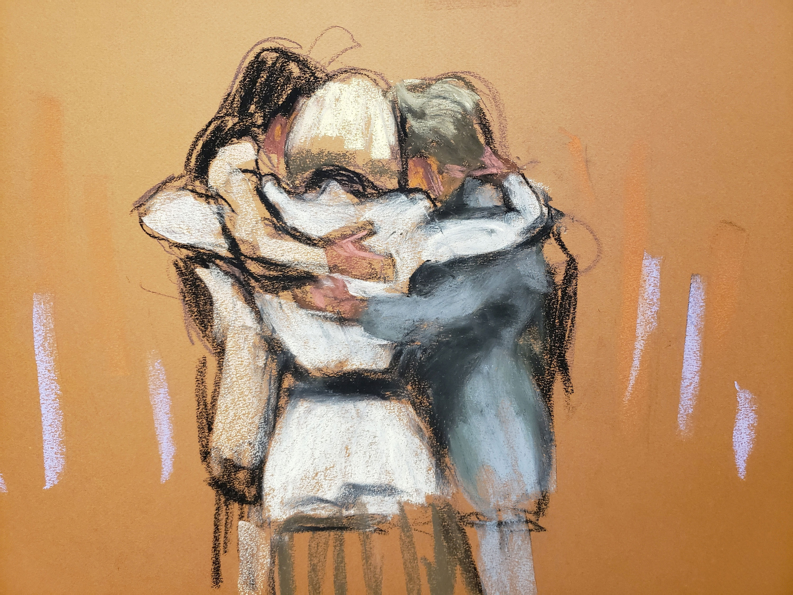 E. Jean Carroll hugs her team after the verdict was read Friday, in this courtroom sketch. 