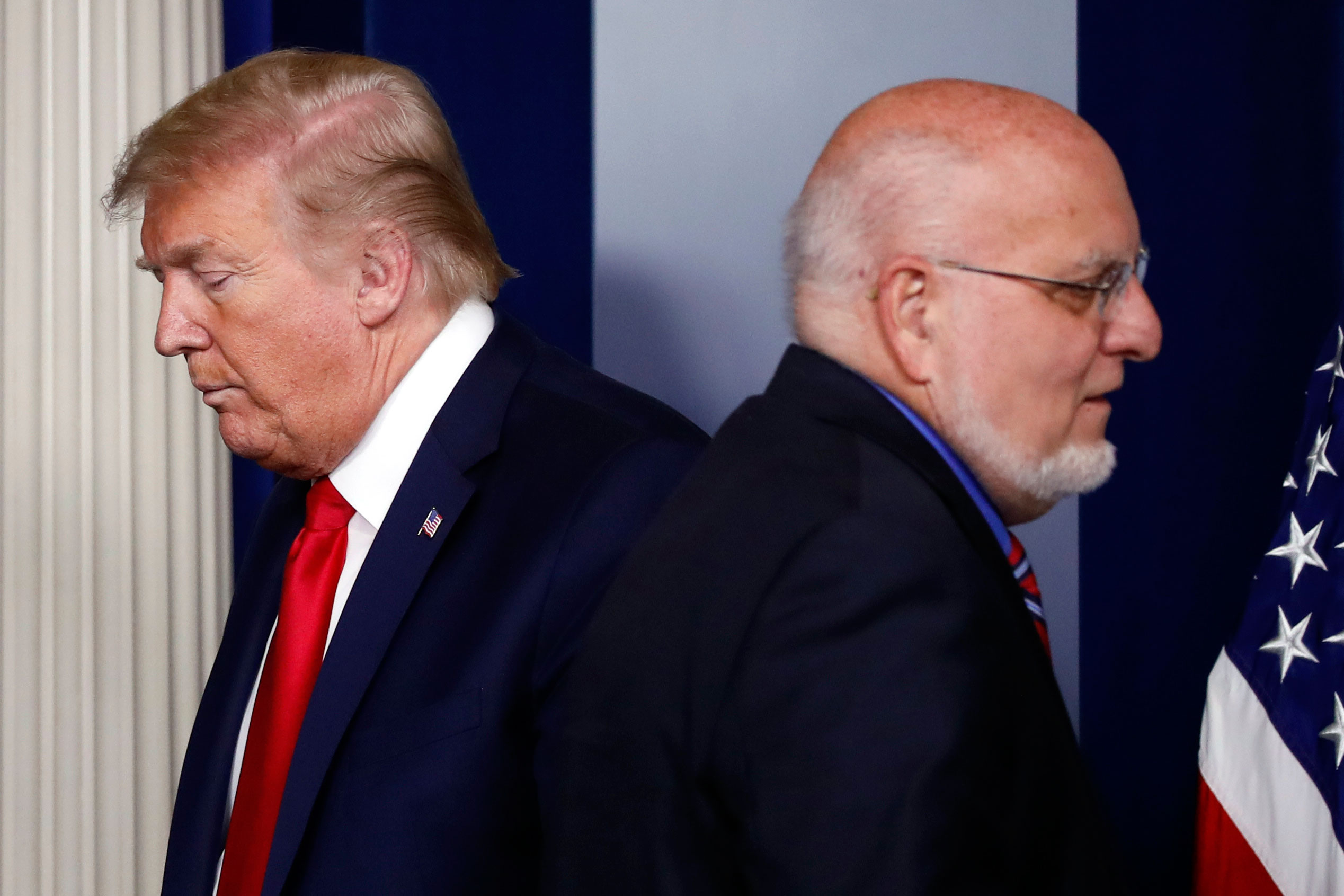 President Donald Trump and CDC Director Robert Redfield attend the daily coronavirus briefing at the White House, in Washington, on April 22.