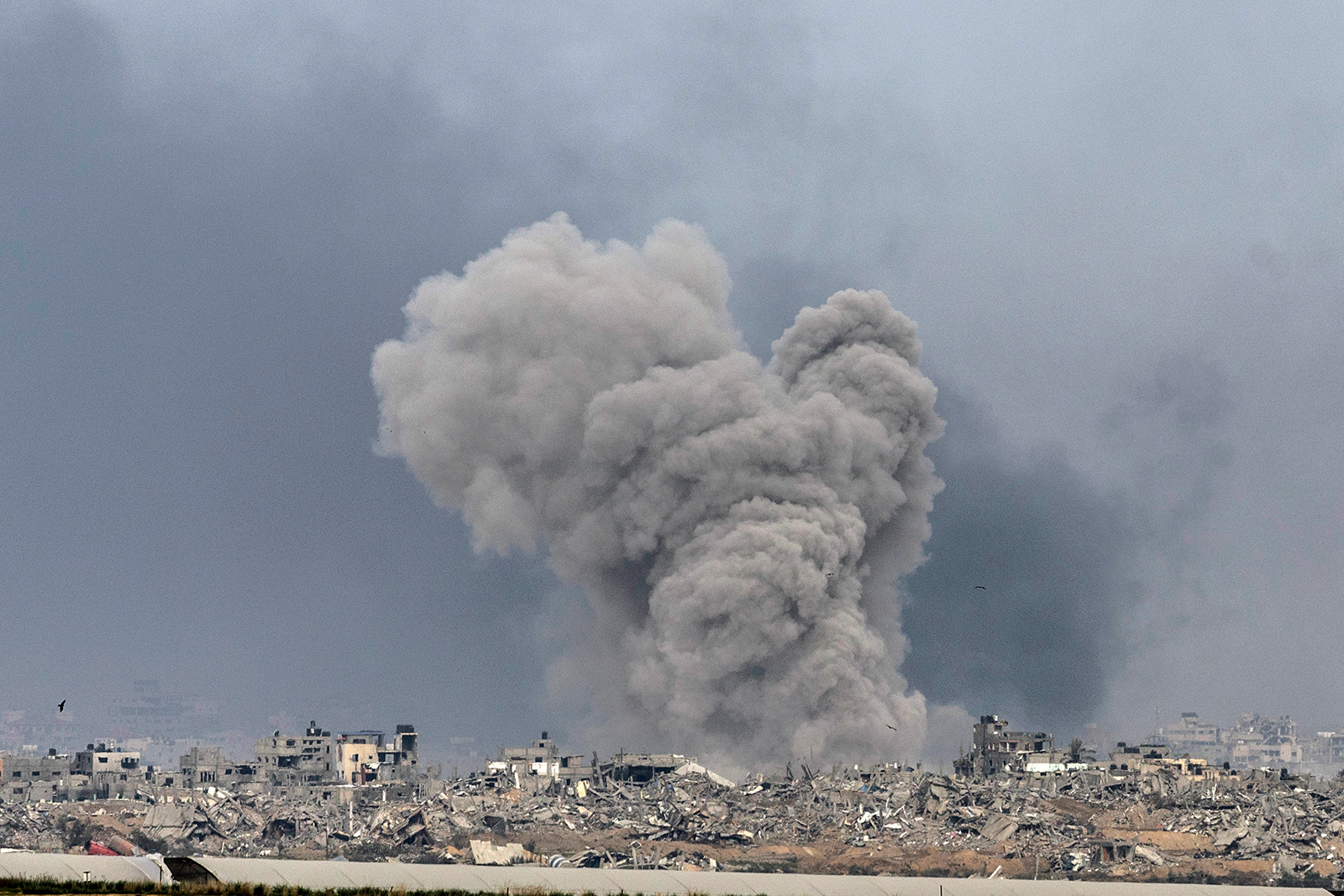 Smoke rises over northern Gaza, as seen from Israel on December 21.
