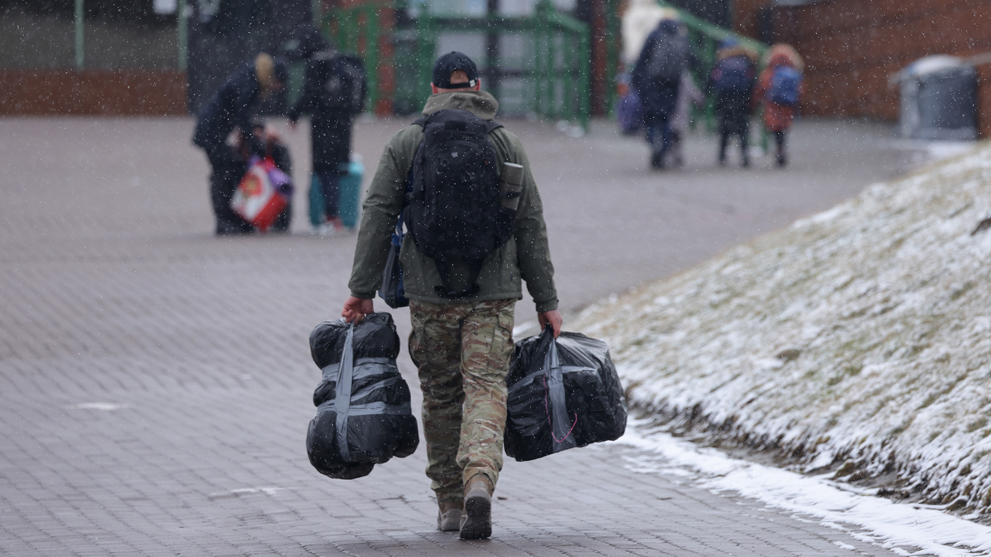 A man who said he wants to join the fight against the Russian army crosses into Ukraine at the Medyka border crossing on March 09, 2022