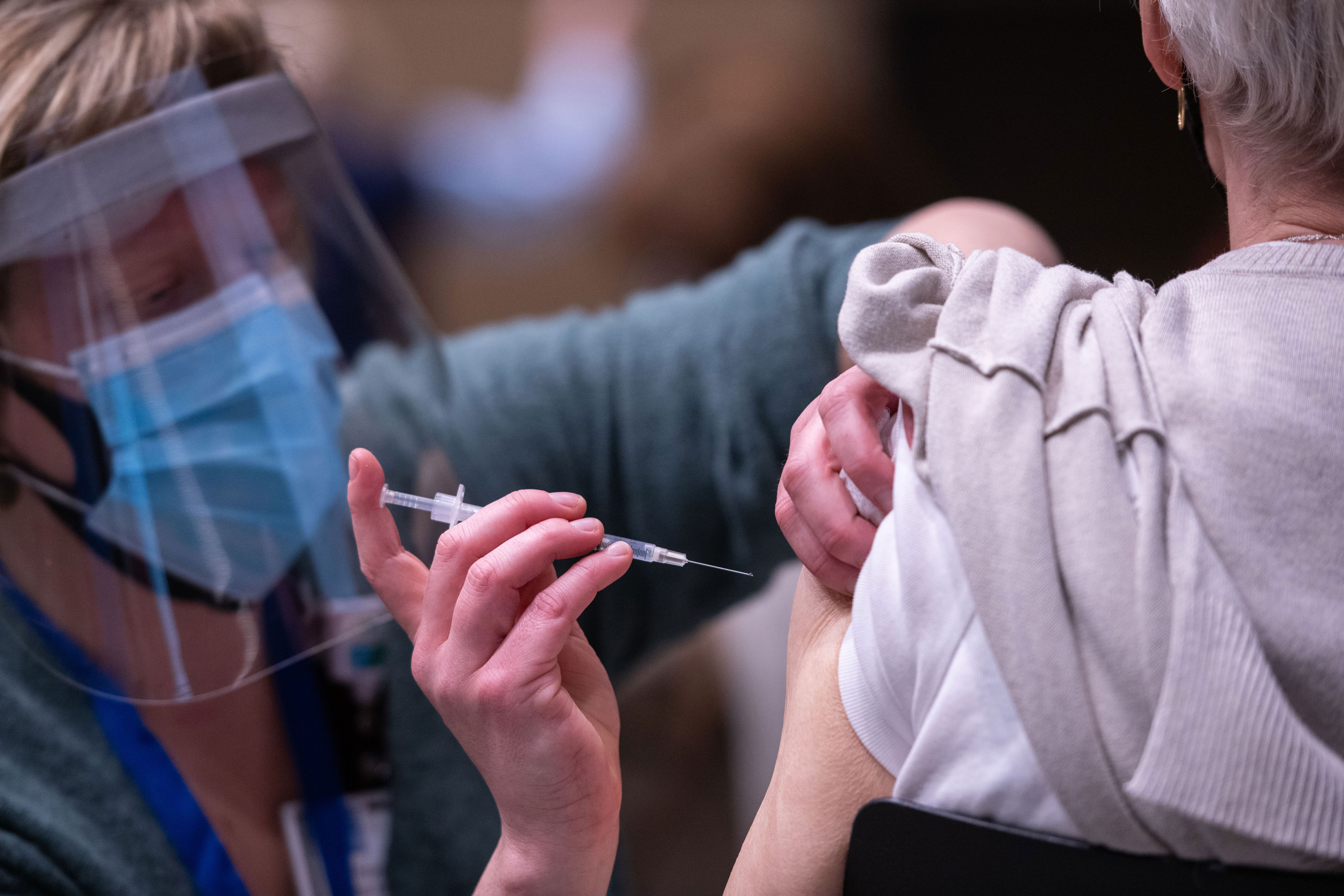 A person receives the Pfizer Covid-19 vaccine in Seattle on January 24.
