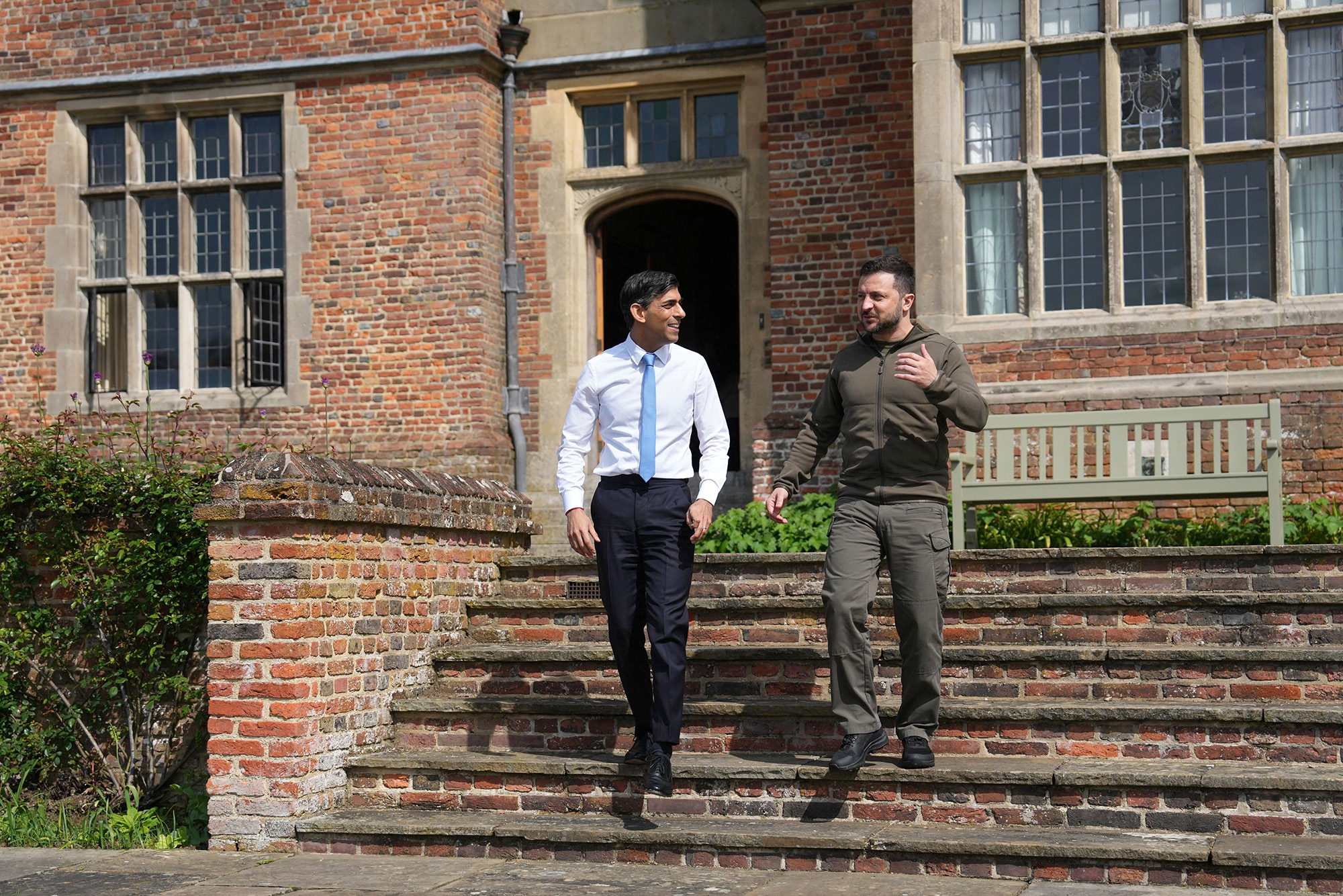 Britain's Prime Minister Rishi Sunak, left, talks with Ukraine's President Volodymyr Zelensky as they walk in the garden at Chequers, near Ellesborough, England, on May 15.