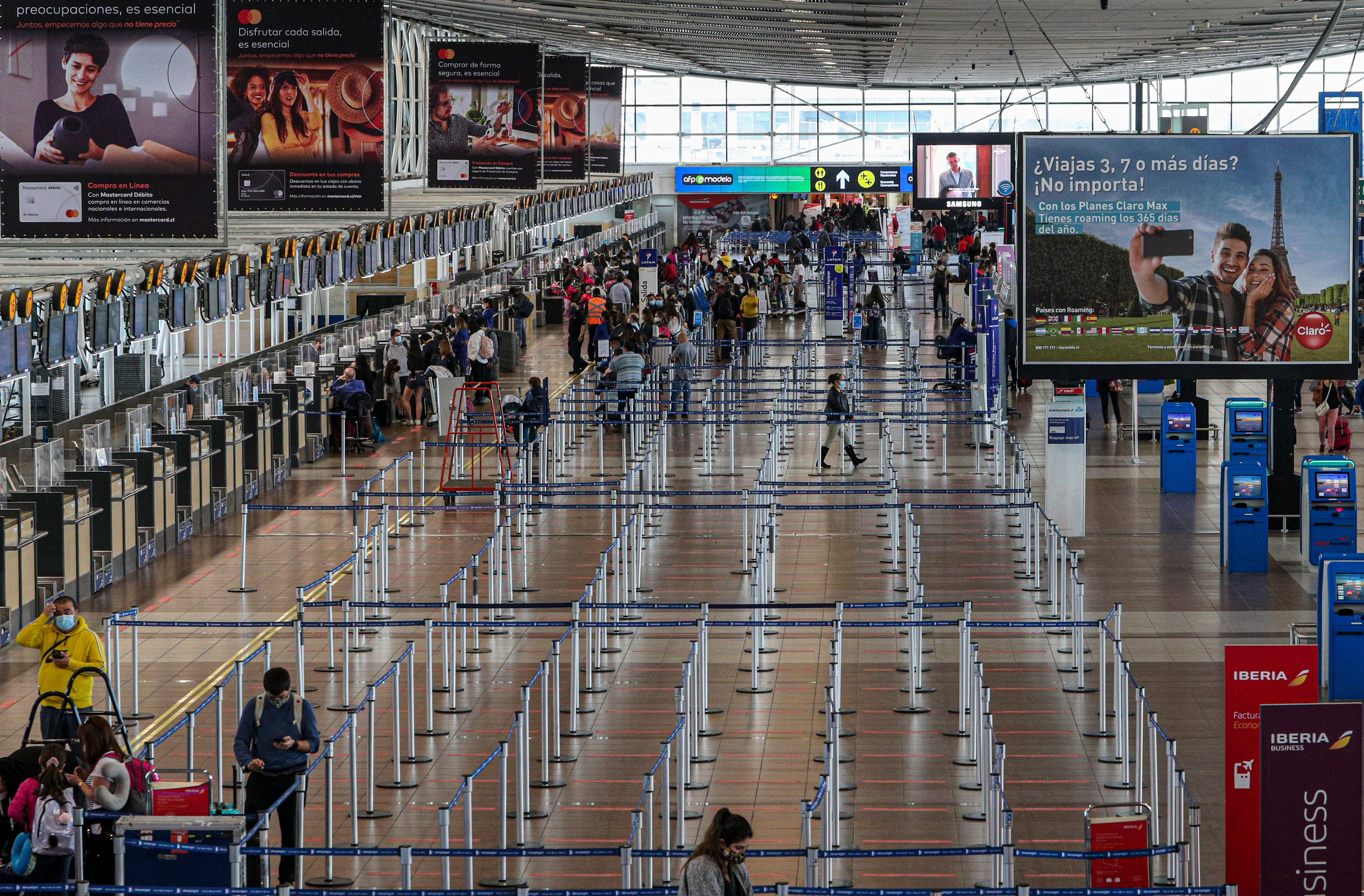 Travelers in the check-in area of Arturo Merino Benítez International Airport in Santiago, Chile, on November 13.