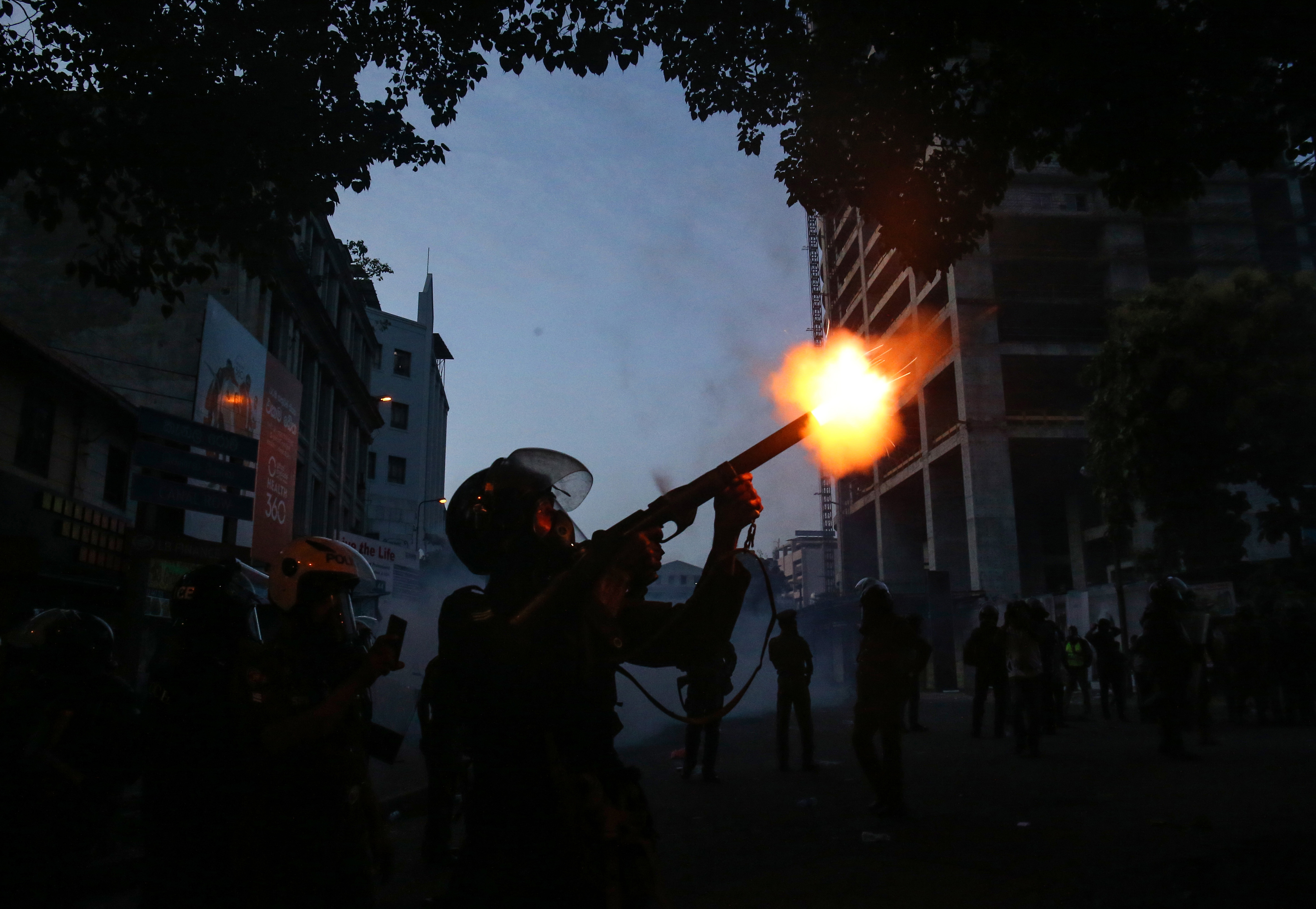 Police use tear gas to disperse university students who were demanding the resignation of Sri Lankan President Gotabaya Rajapaksa, on July 8, in Colombo, Sri Lanka. 