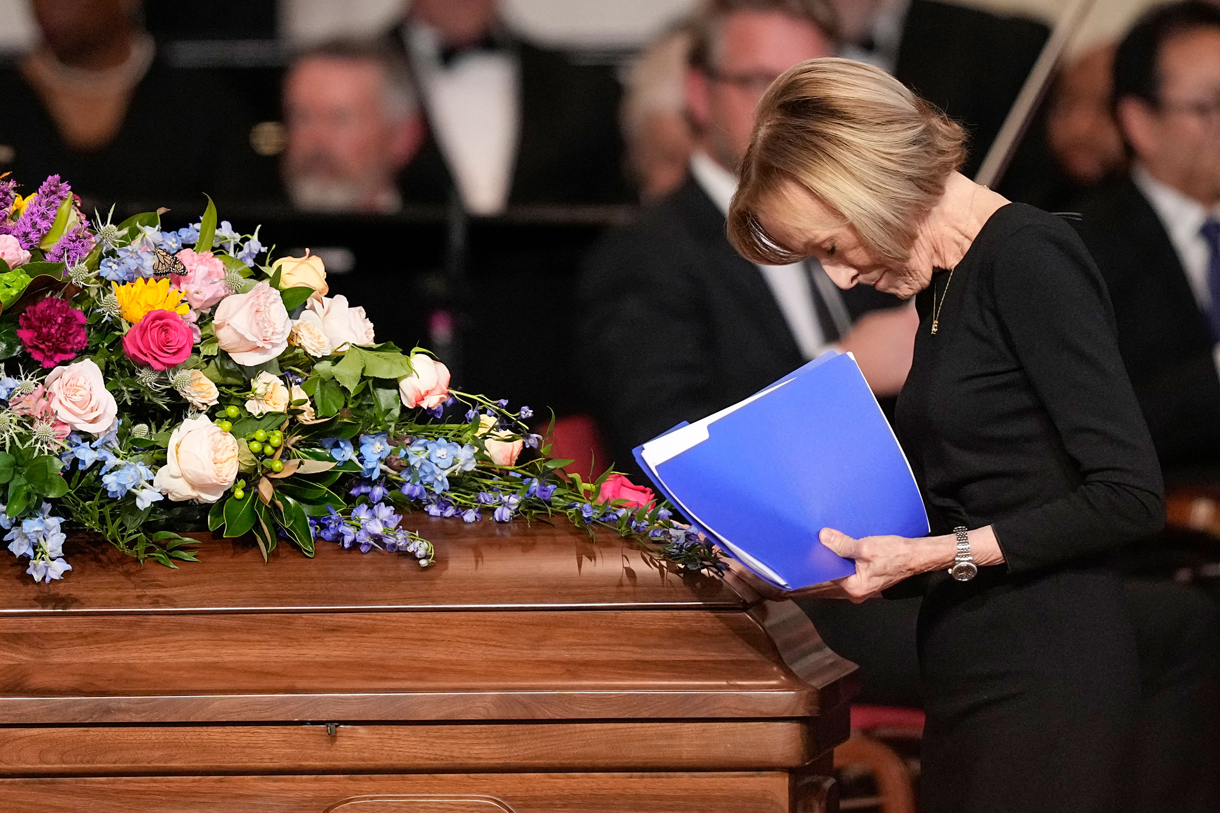 Judy Woodruff pauses at the casket after speaking during a tribute service for former first lady Rosalynn Carter at Glenn Memorial Church in Atlanta, on November 28.