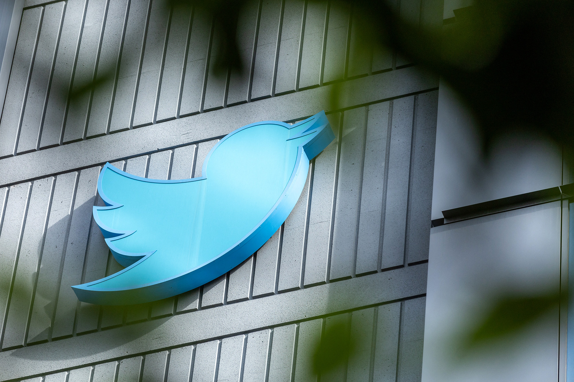 The Twitter logo is seen on a sign on the exterior of Twitter headquarters in San Francisco, California, on October 28.