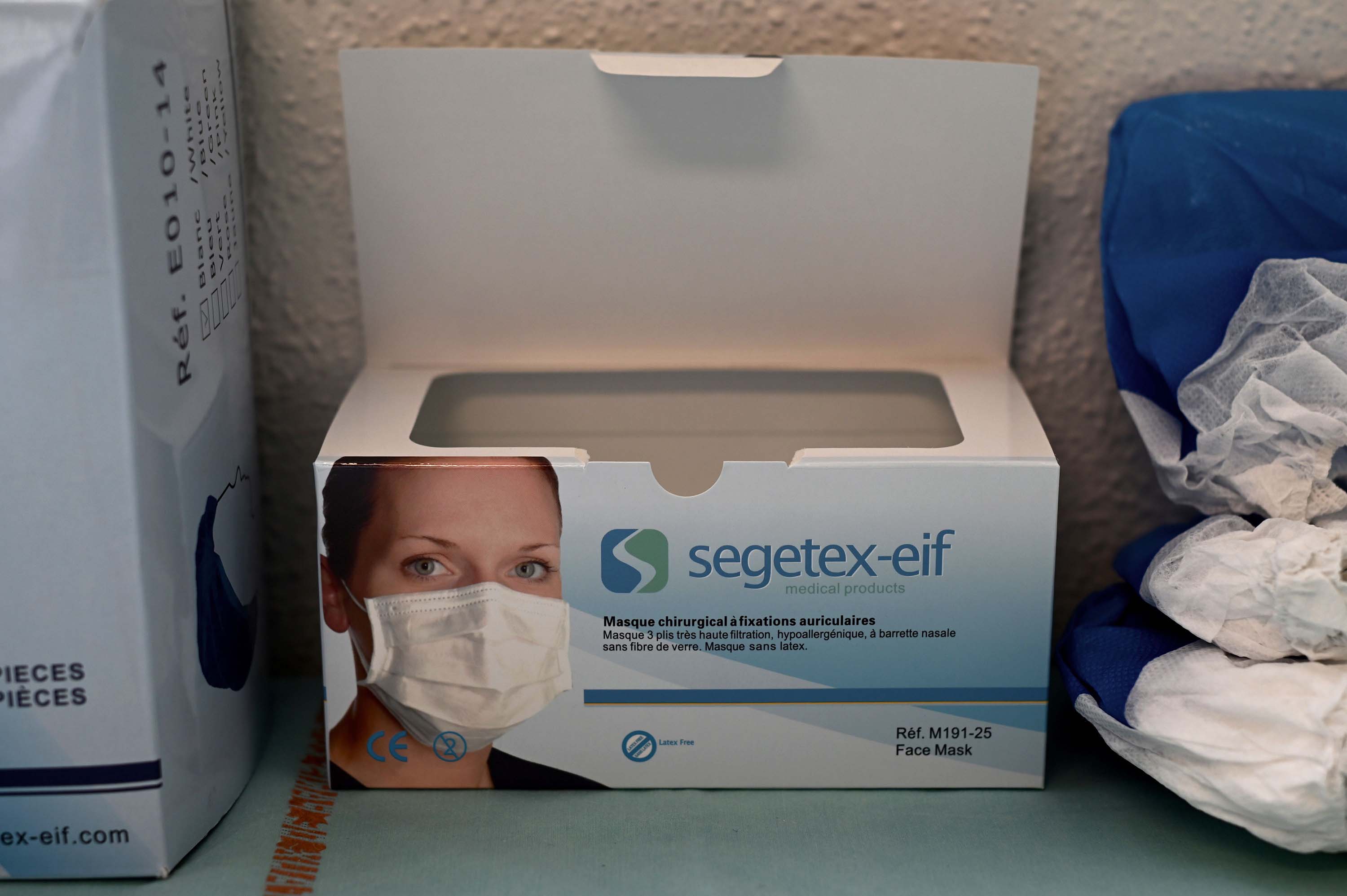 A picture shows a box of protective face masks at a hospital in Paris on March 13.