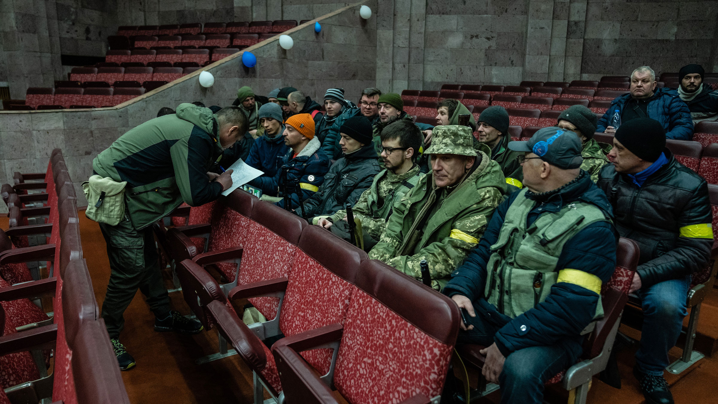 Volunteers in Kyiv sign up to join the Territorial Defense Forces.