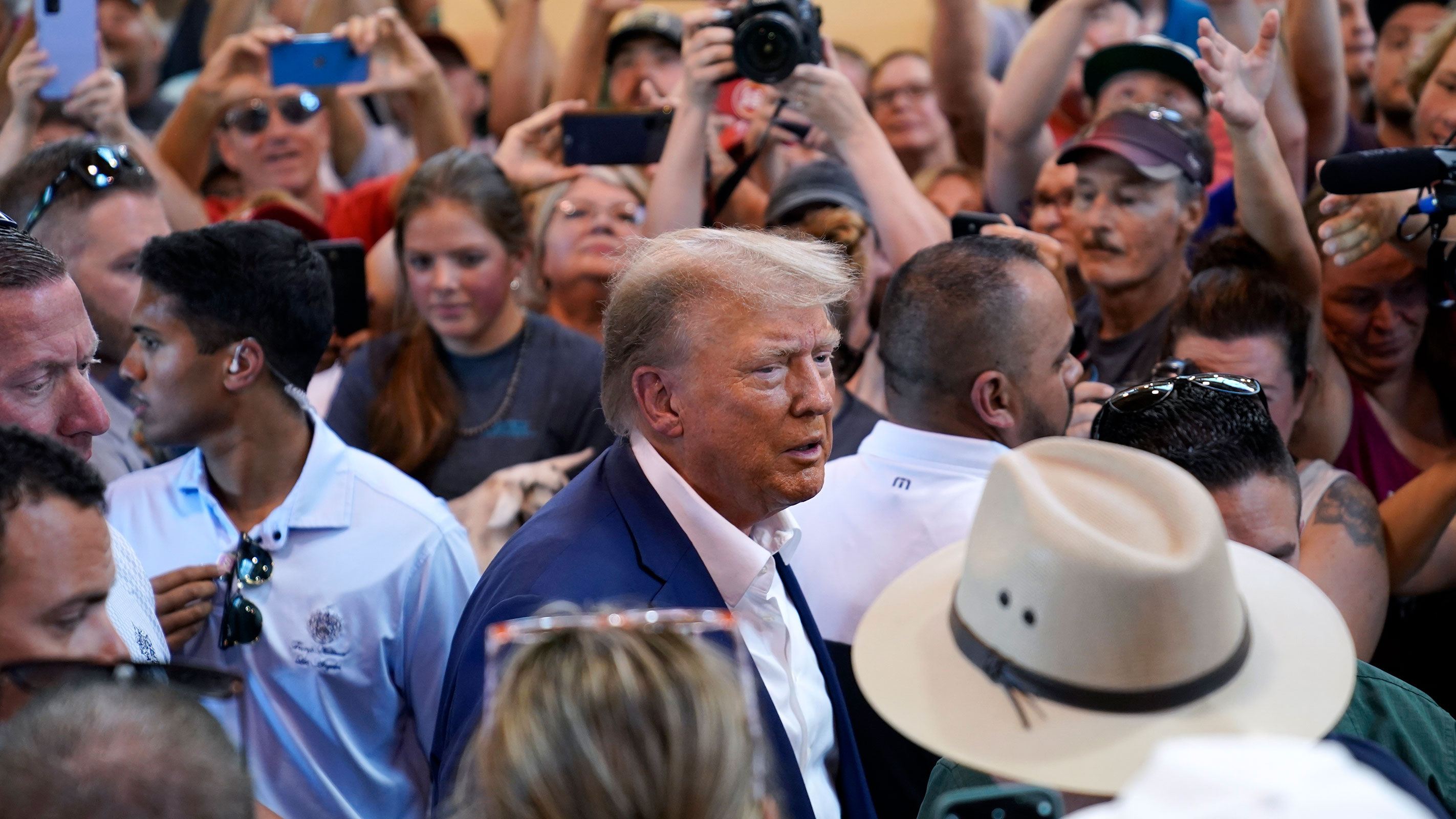 Republican presidential candidate former President Donald Trump greets supporters at the Iowa Pork Producers tent during a visit to the Iowa State Fair, Saturday, Aug. 12, 2023, in Des Moines, Iowa.