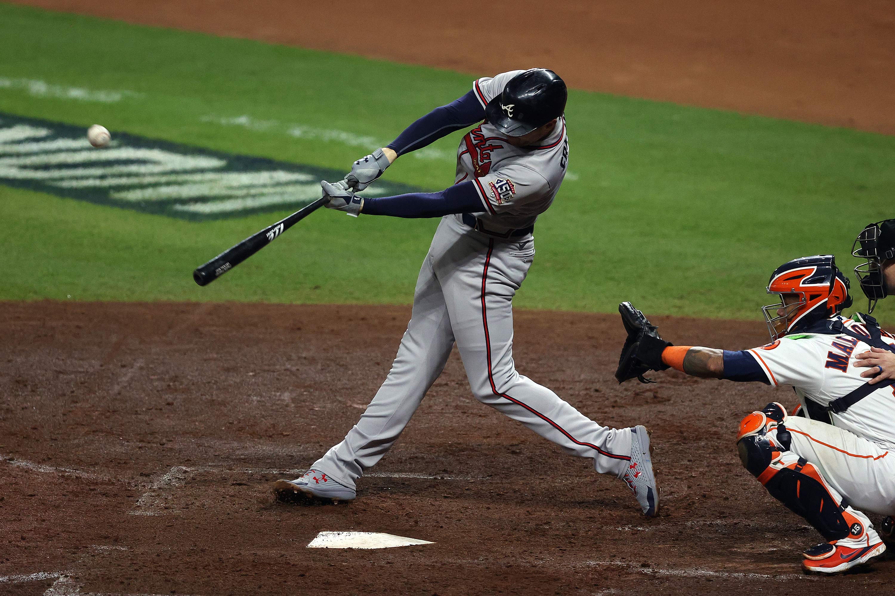 Freddie Freeman of the Braves hits an RBI double during the fifth inning in Game 6.