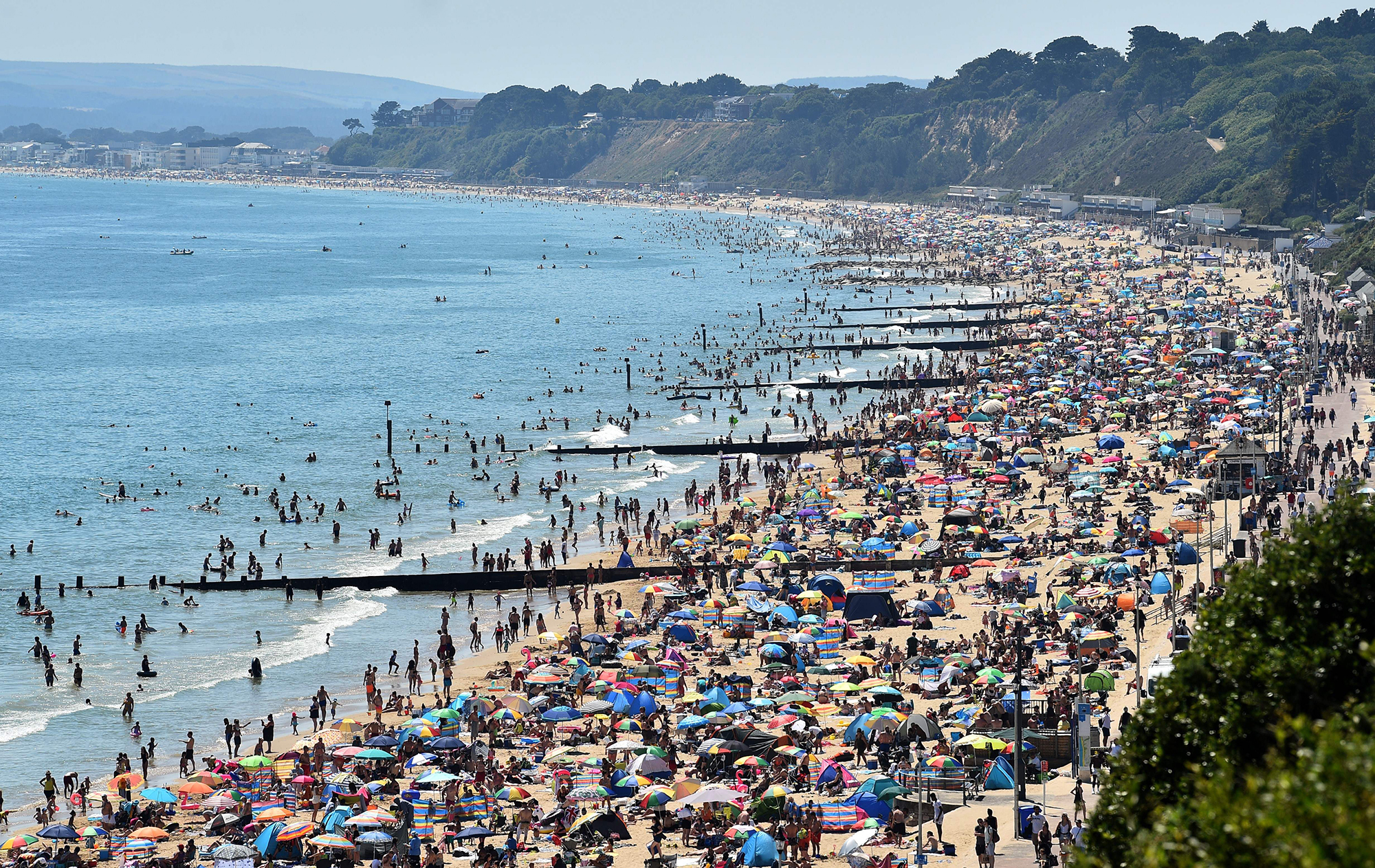 Crowds on the beach in Bournemouth, southern England, on June 25, 2020.